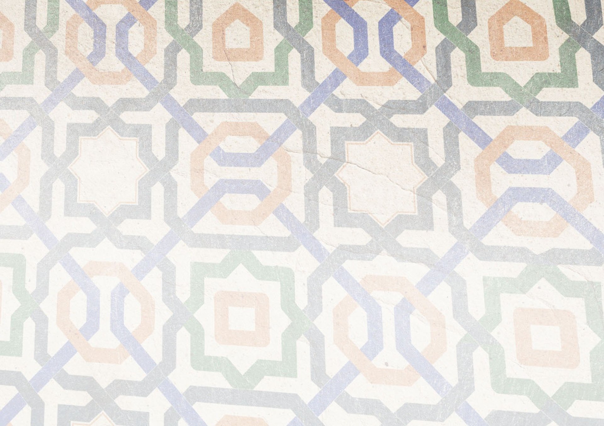 closeup photo of white, orange, and gray area rug