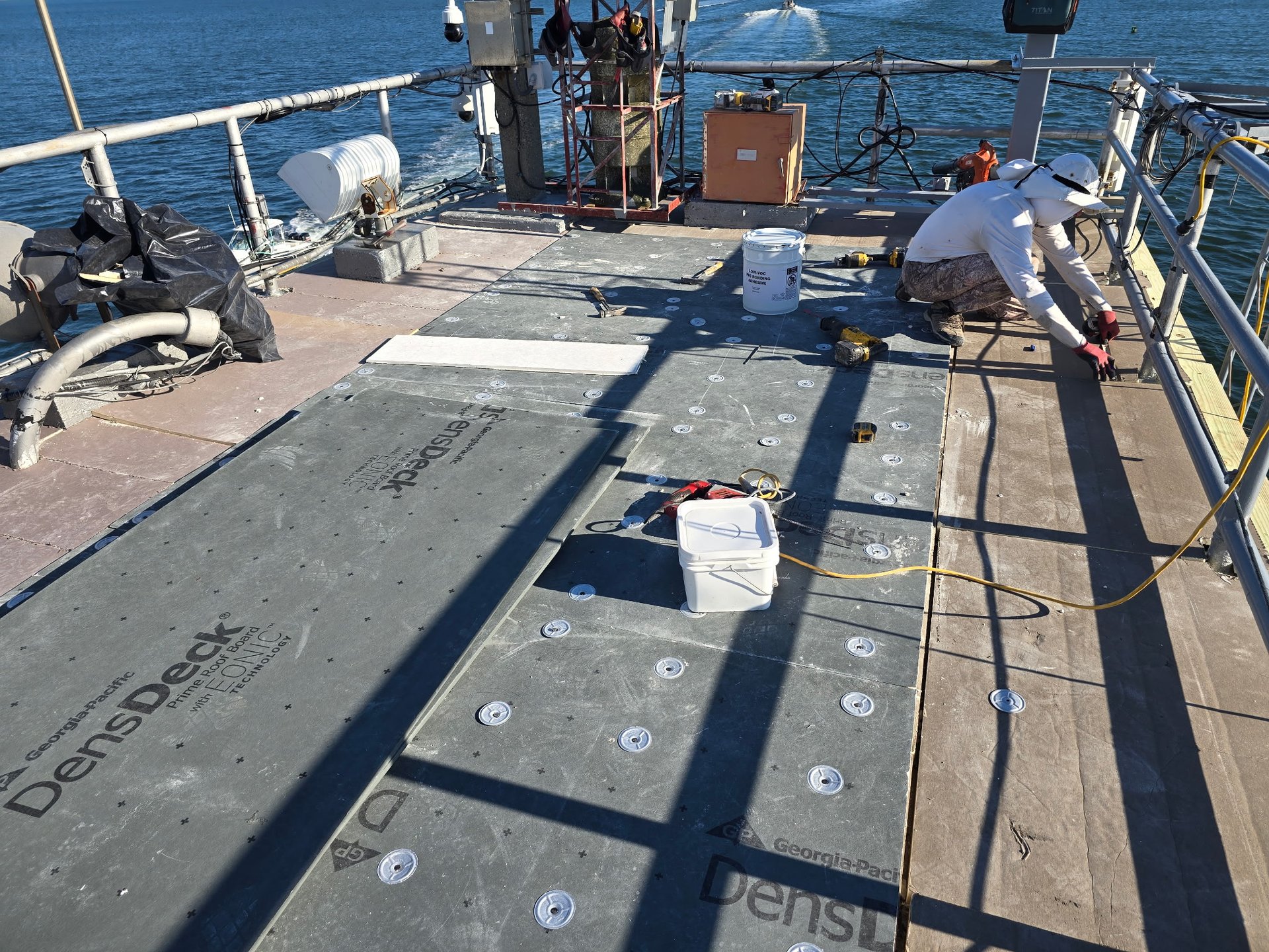 an abstract photo of a curved building with a blue sky in the background