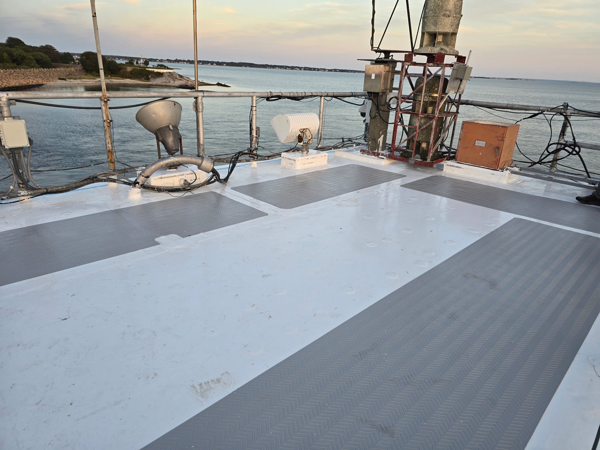 an abstract photo of a curved building with a blue sky in the background