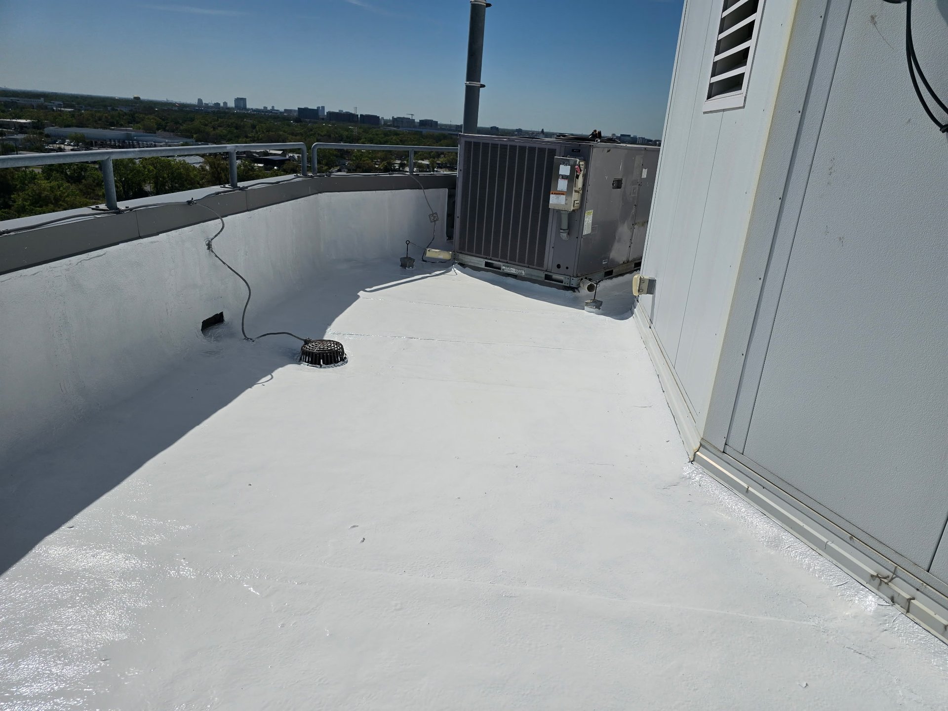an abstract photo of a curved building with a blue sky in the background