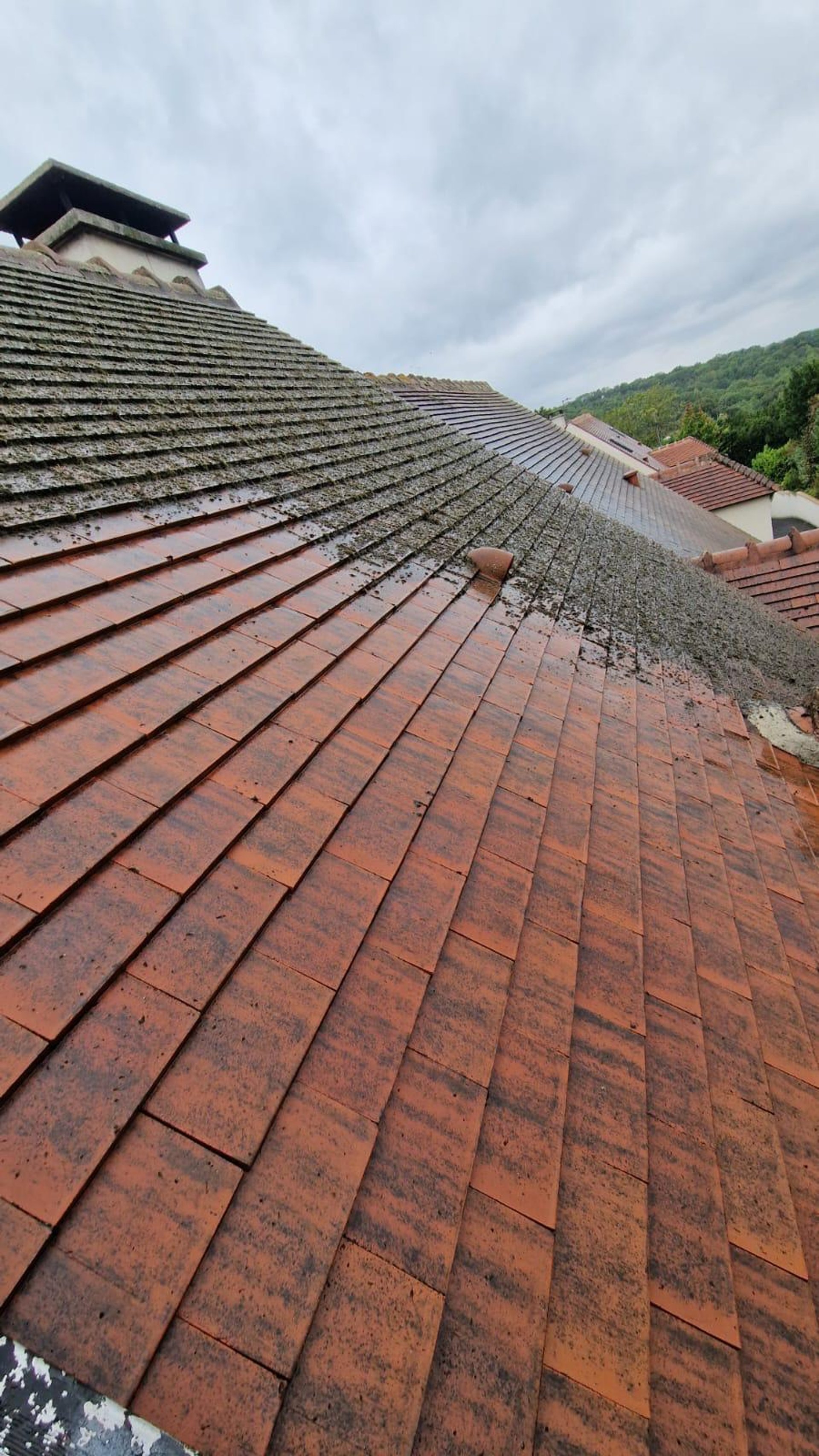 a man on a roof working with a rope
