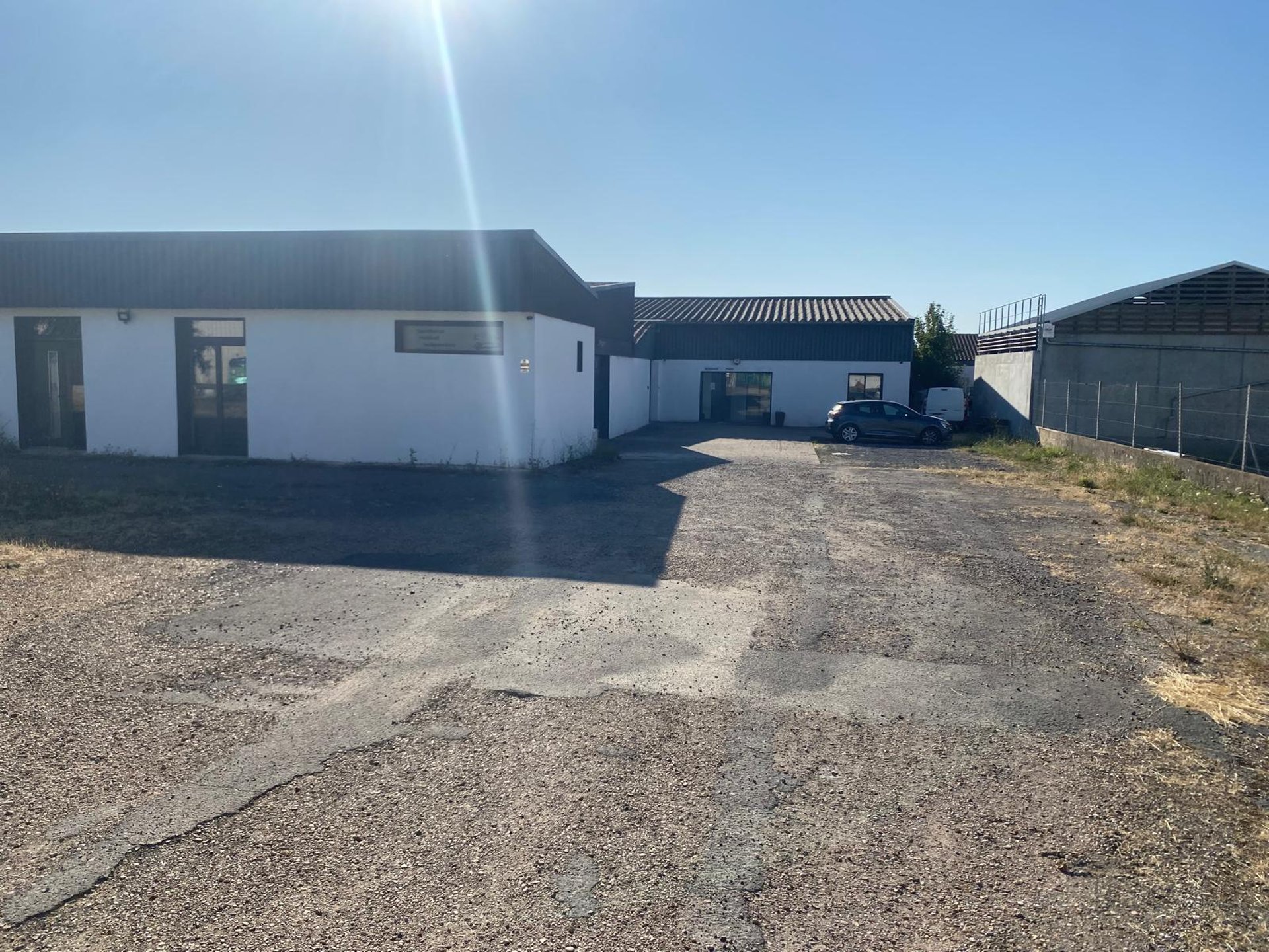 two bullet surveillance cameras attached on wall