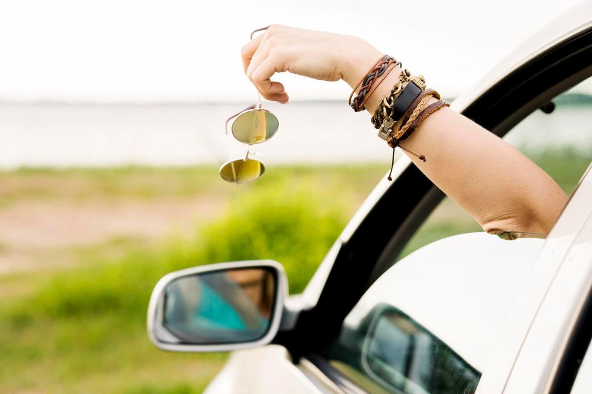 woman wearing yellow long-sleeved dress under white clouds and blue sky during daytime