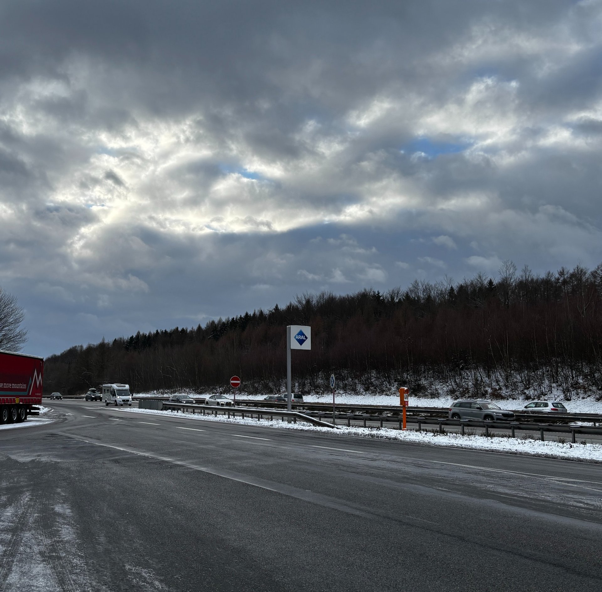a long exposure photo of a highway at night