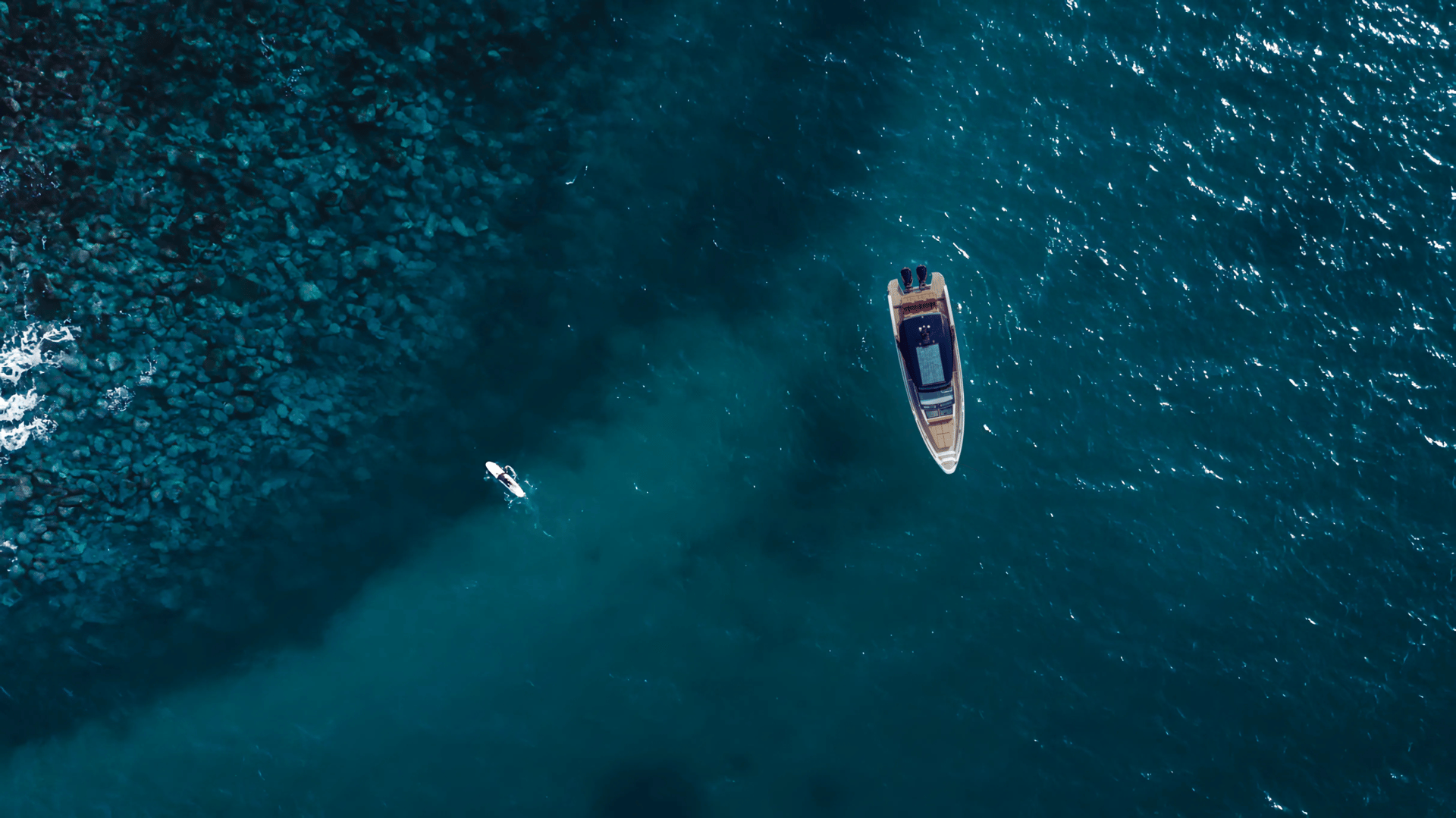 aerial photography of white yacht on calm waters