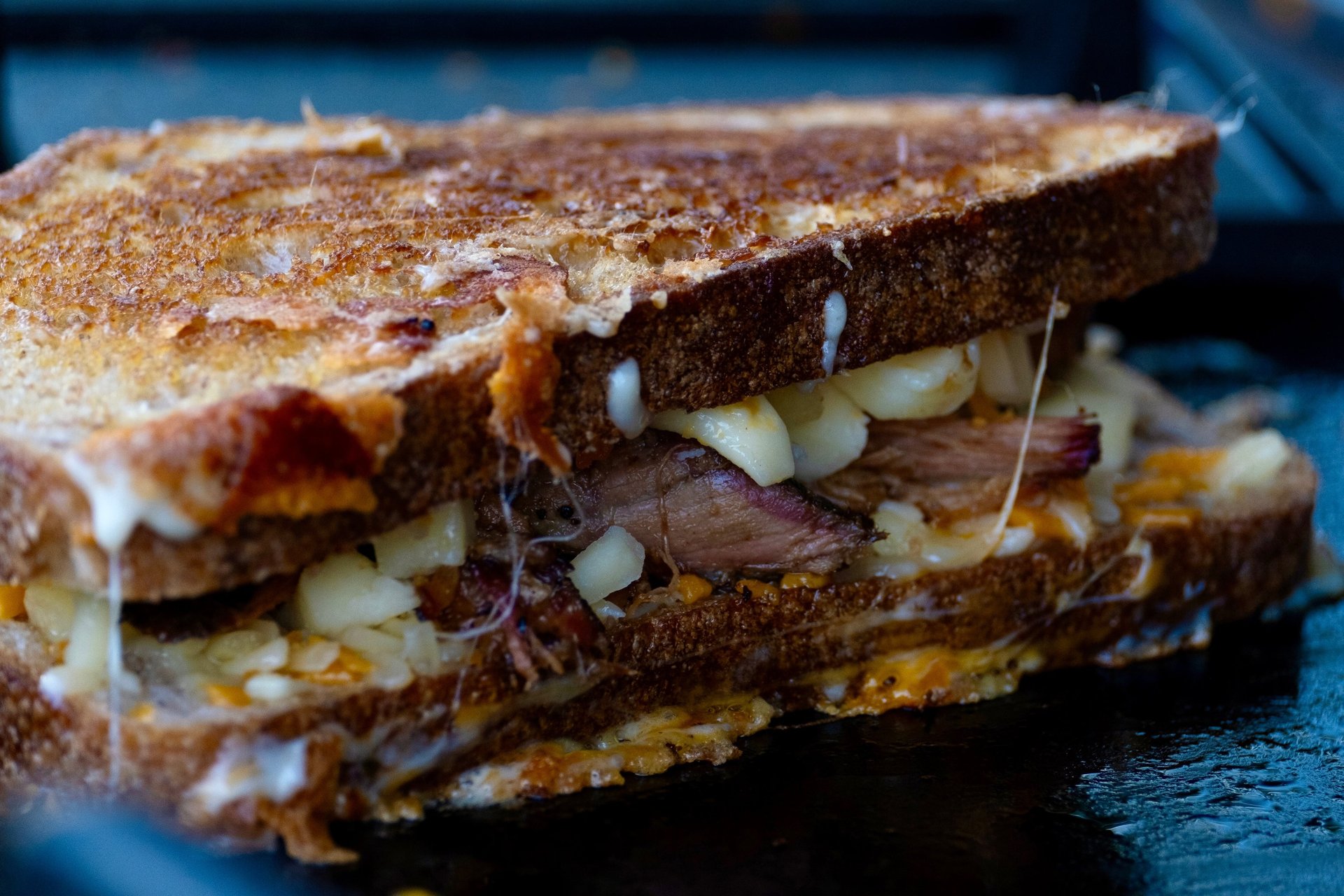black and brown leather padded tub sofa