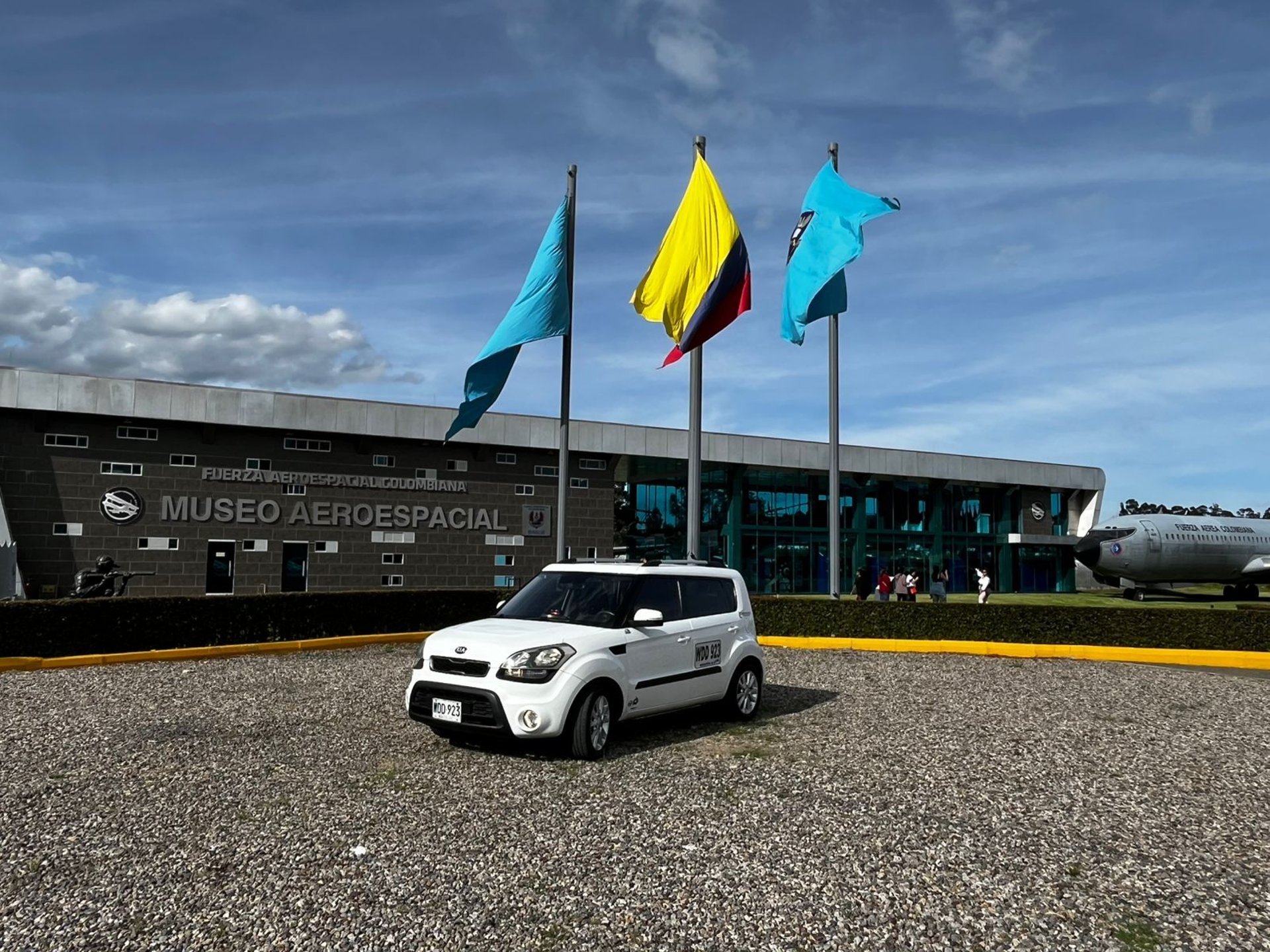 woman wearing yellow long-sleeved dress under white clouds and blue sky during daytime