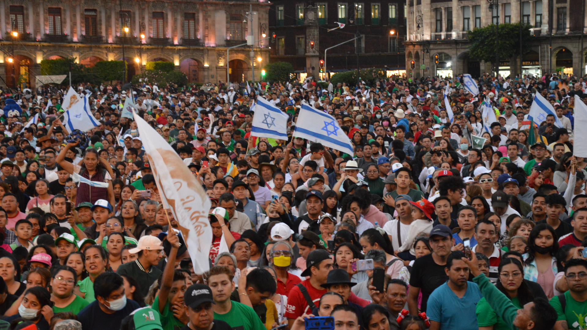 group of people waving their hands