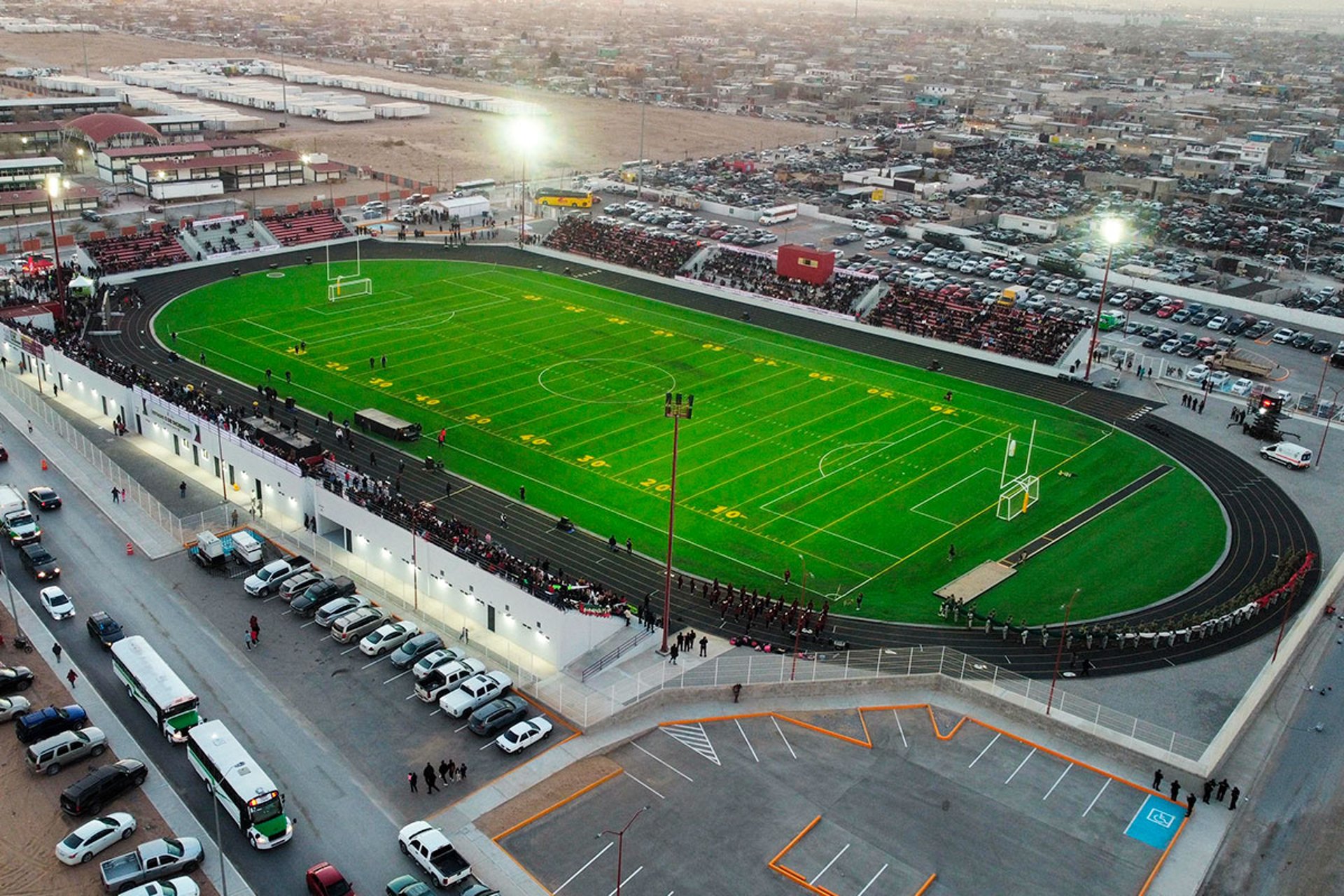 gray concrete pathway between green trees during daytime