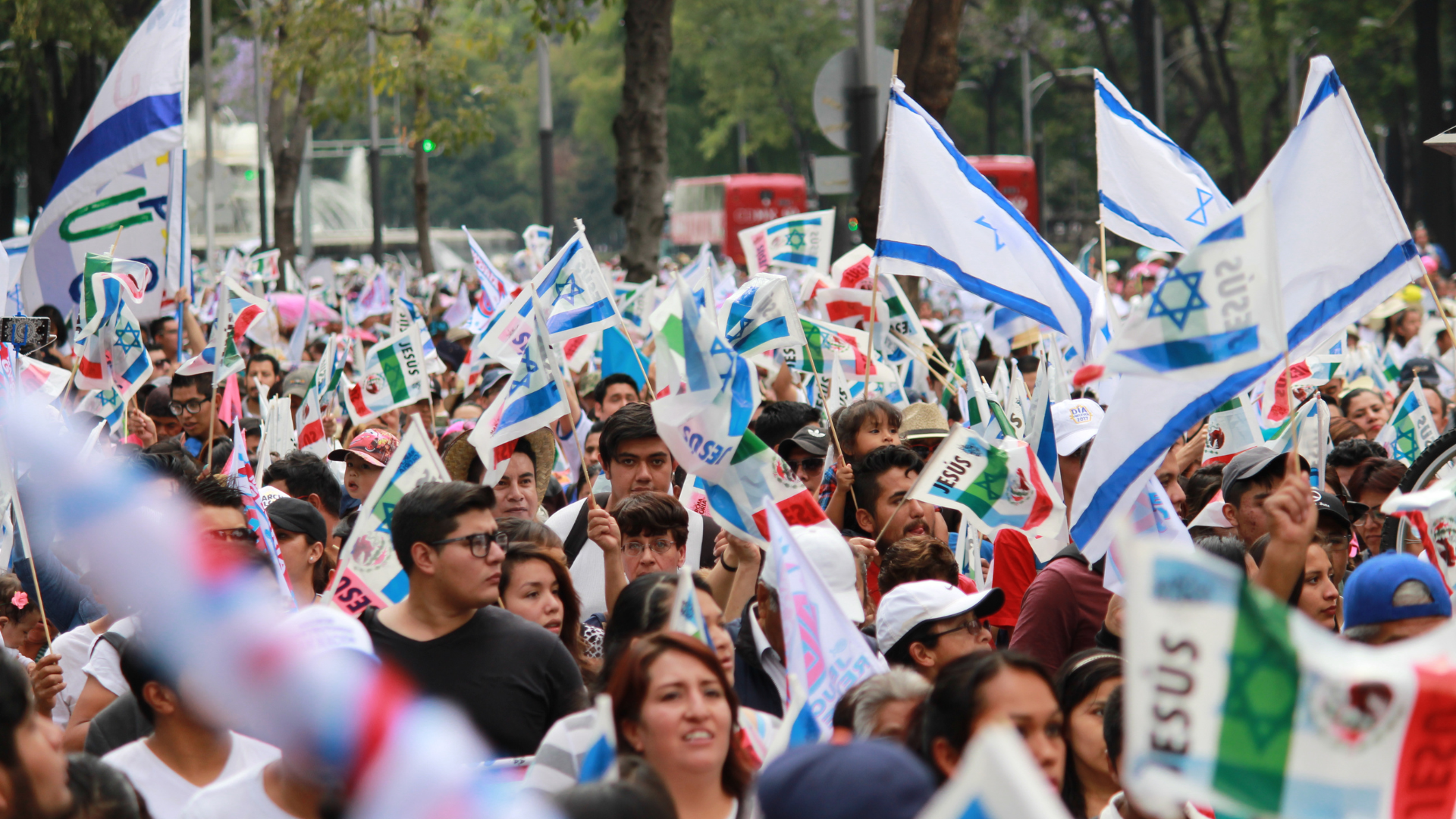 group of people waving their hands