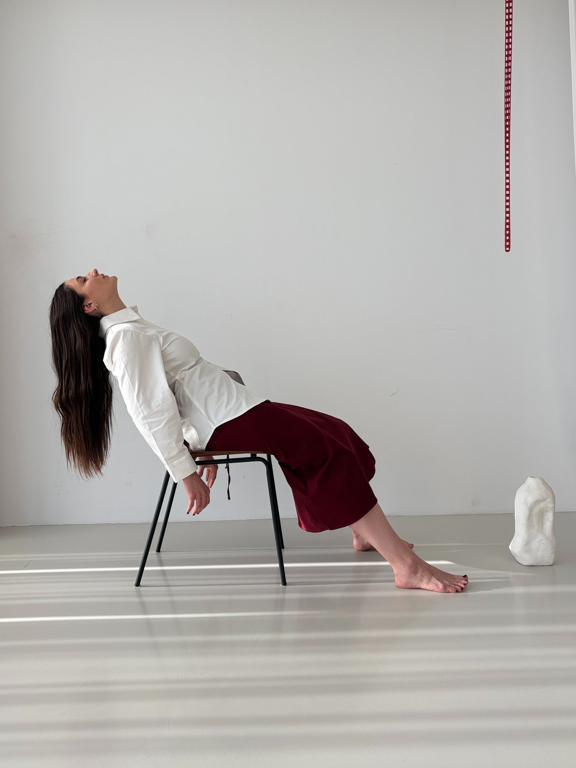 woman holding dried flower