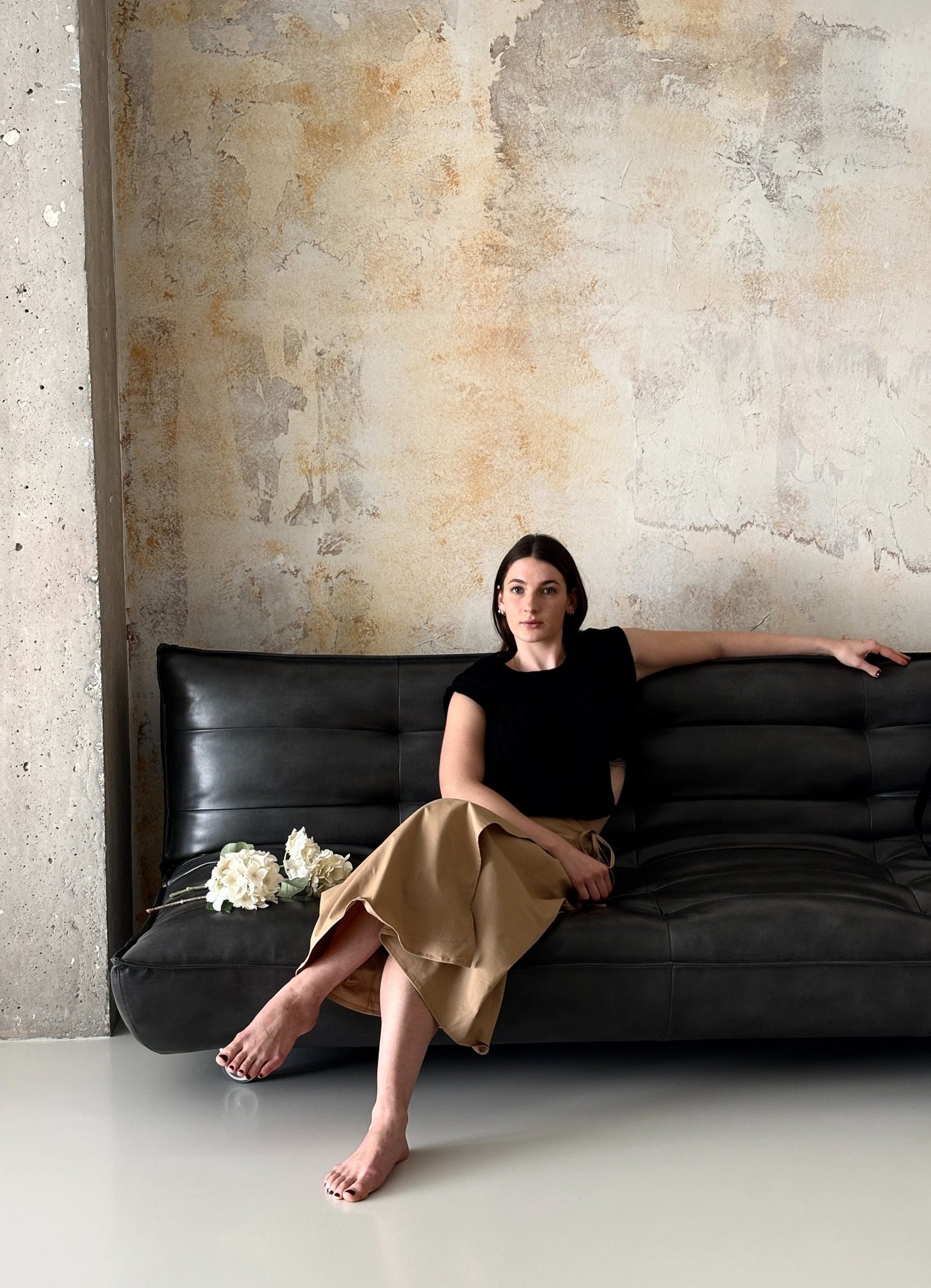 woman holding dried flower
