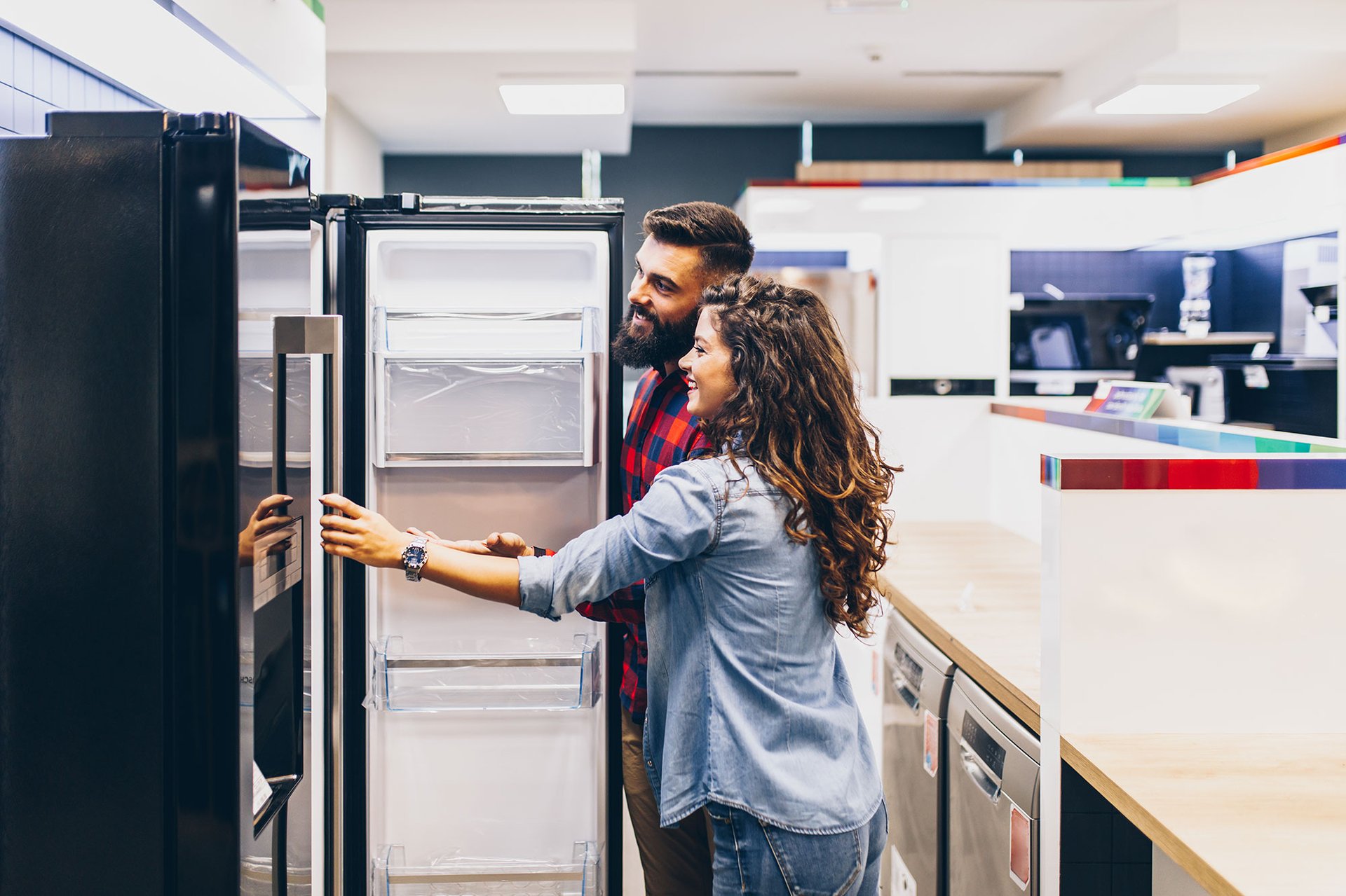 man and woman standing inside kitchen room