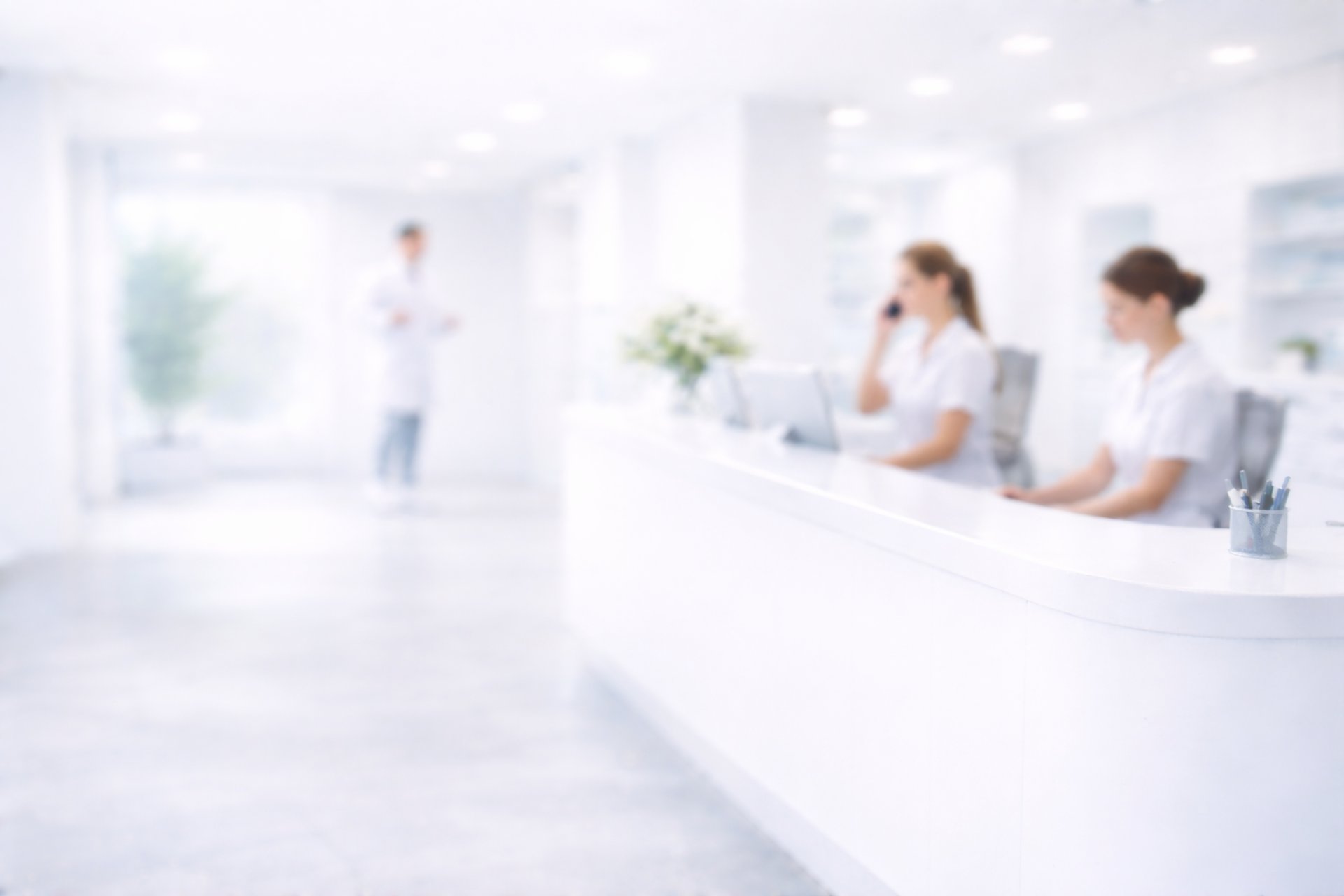 a dental room with a desk and chairs