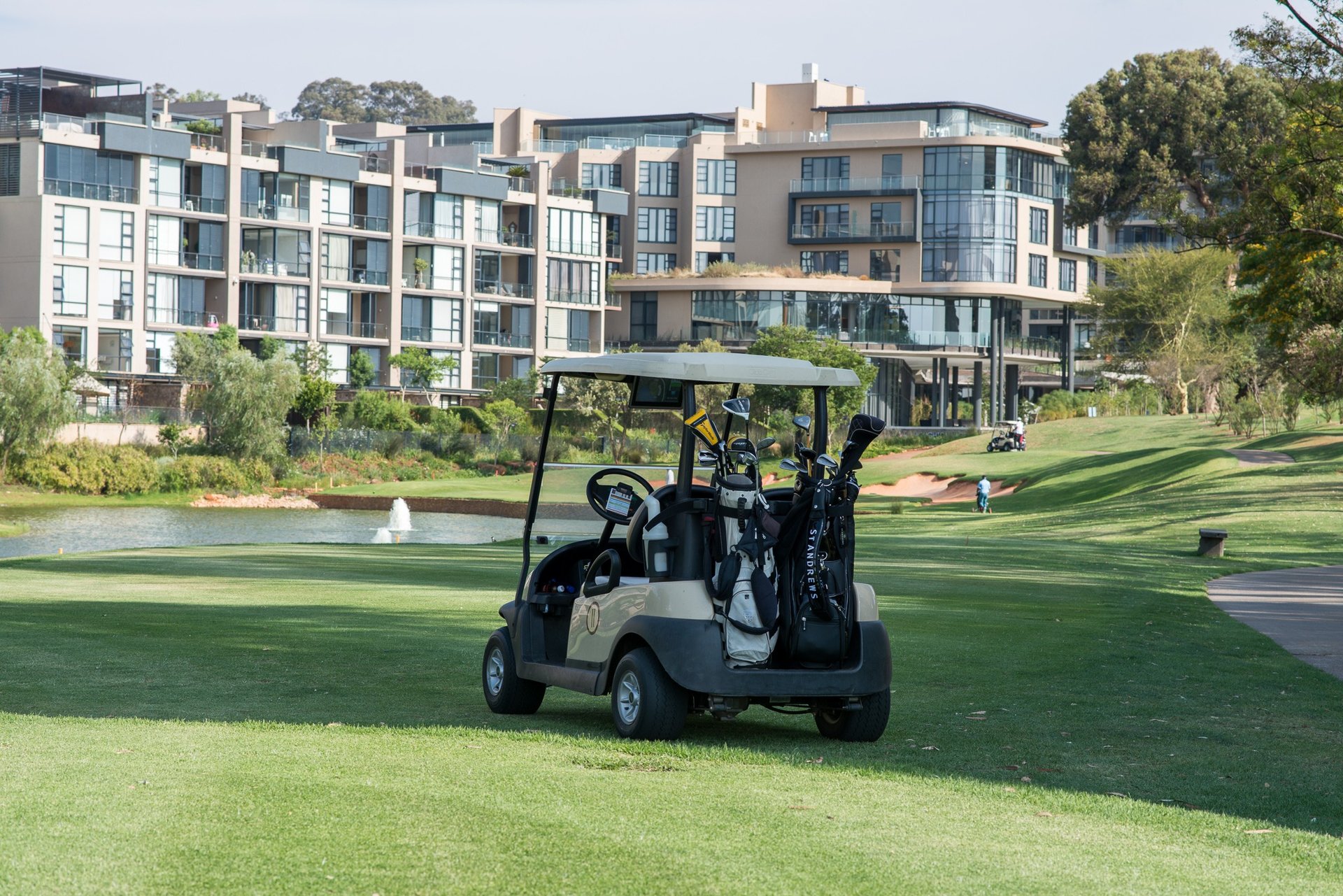 an abstract photo of a curved building with a blue sky in the background