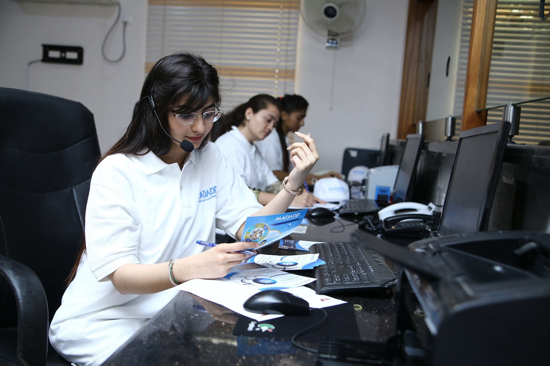 group of people using laptop computer