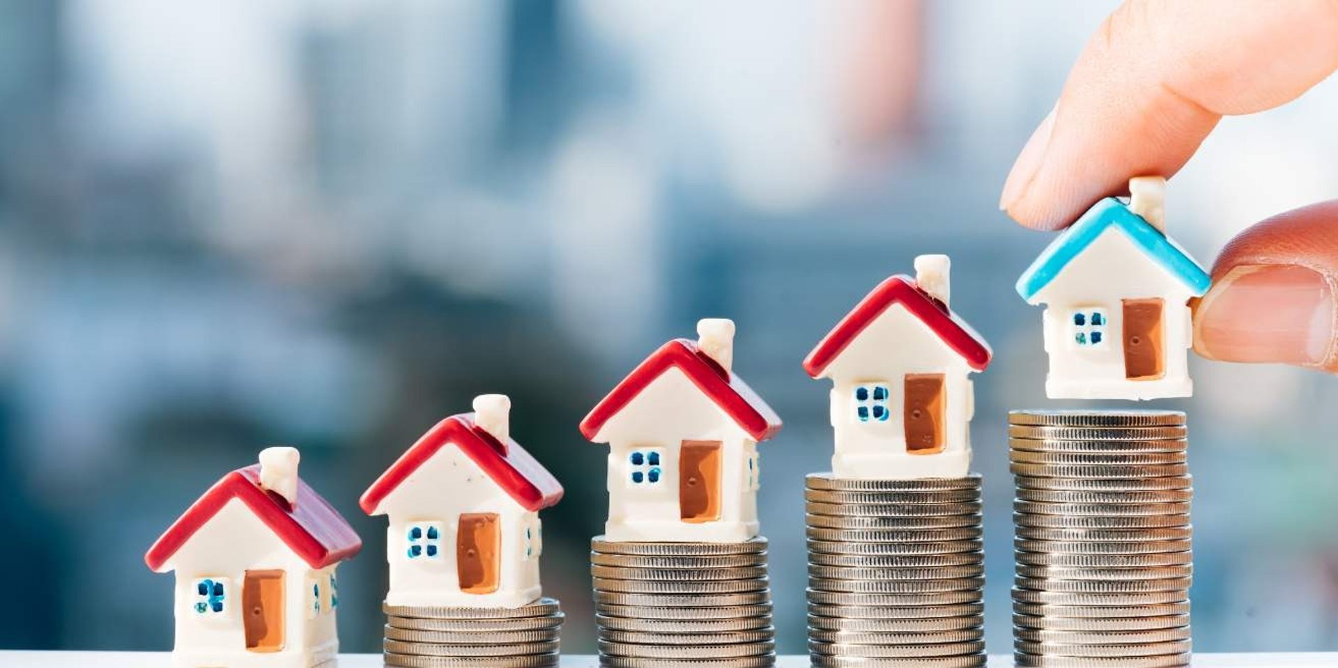 small homes on top of coins