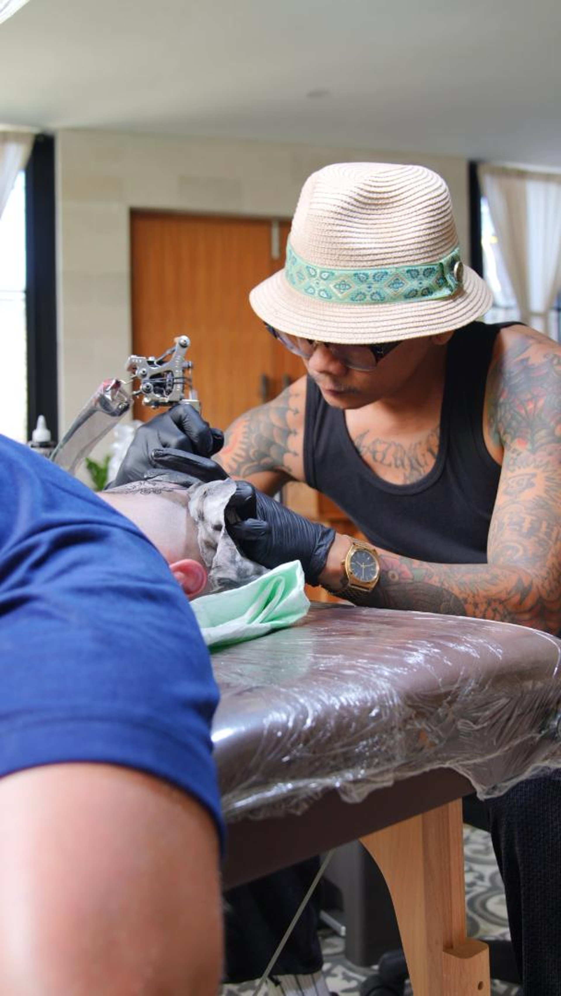 person holding tattoo machine