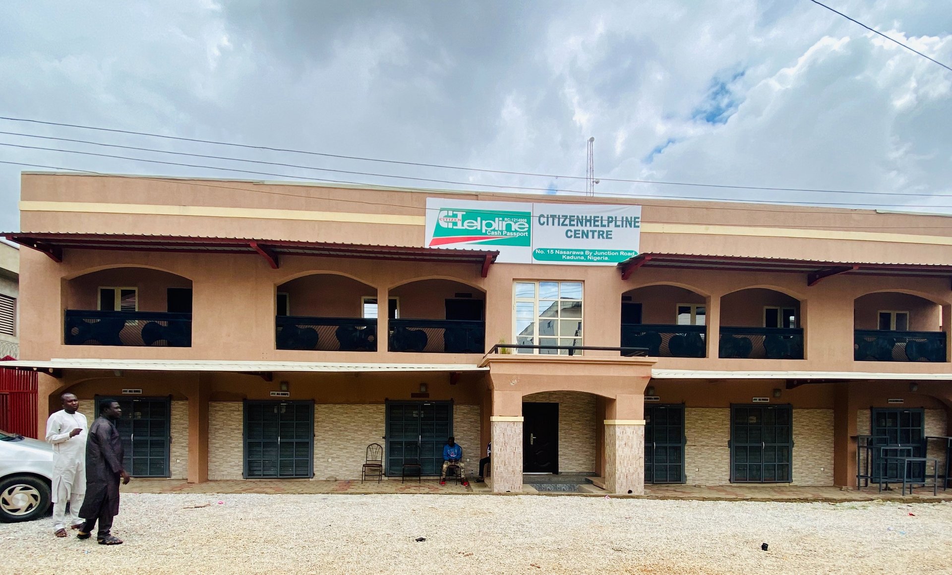 an abstract photo of a curved building with a blue sky in the background