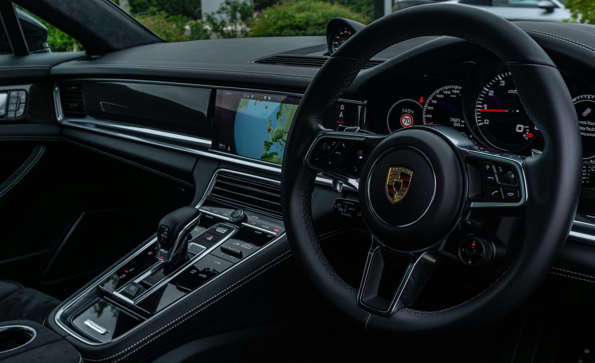 black and brown nissan steering wheel
