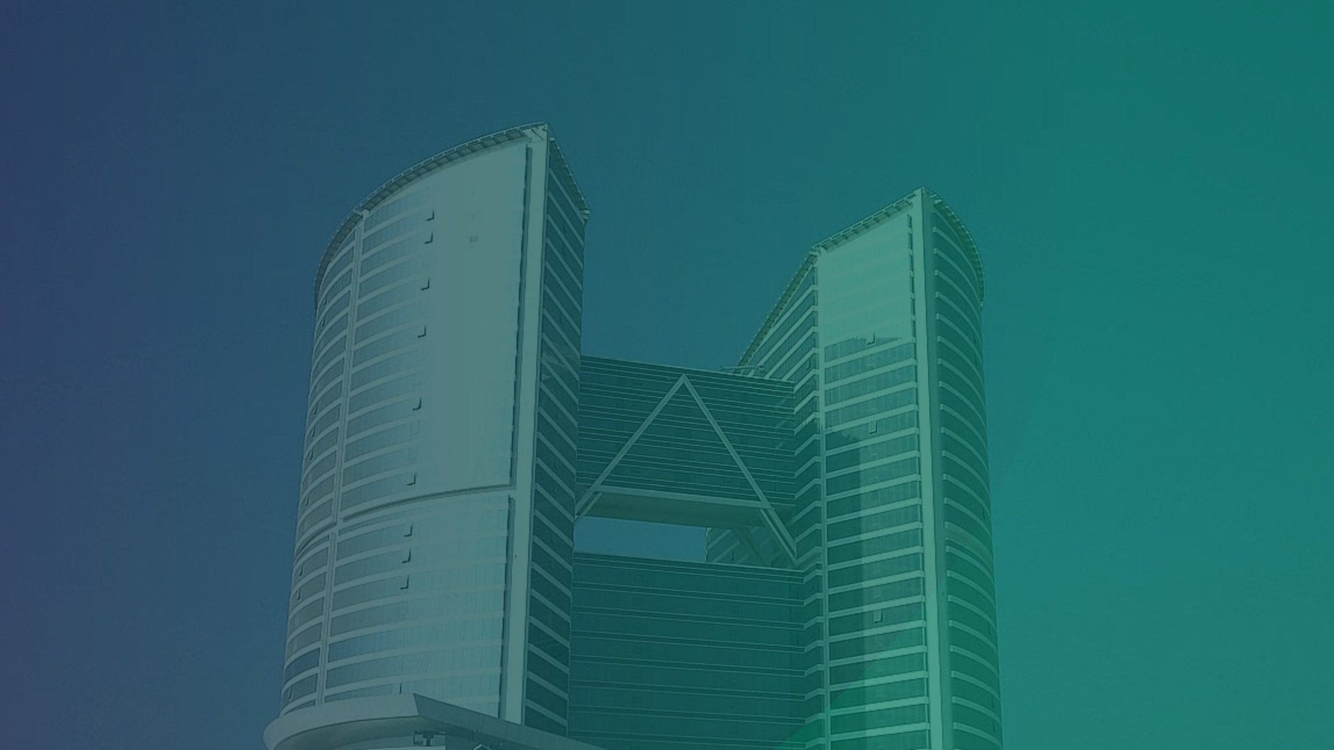 an abstract photo of a curved building with a blue sky in the background
