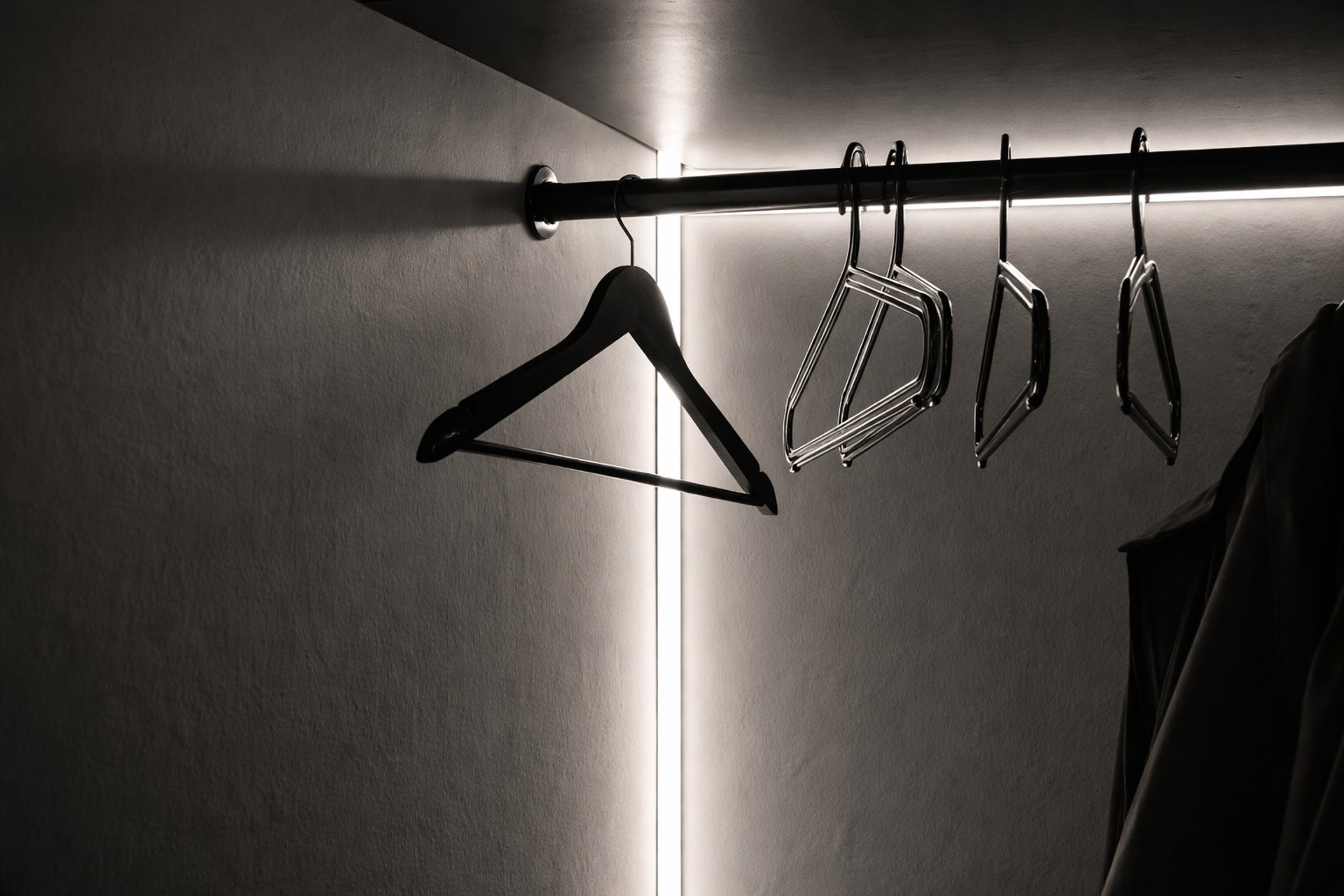 an abstract photo of a curved building with a blue sky in the background