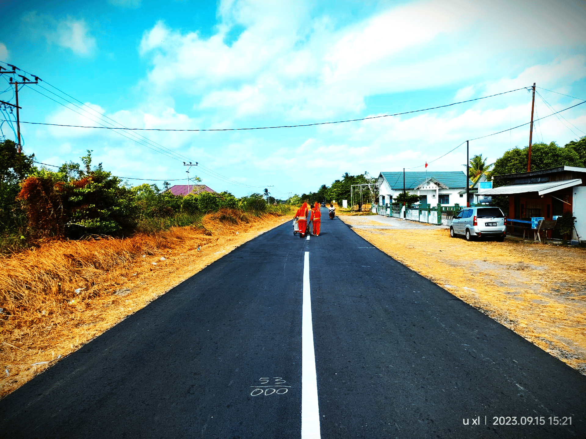 woman wearing yellow long-sleeved dress under white clouds and blue sky during daytime