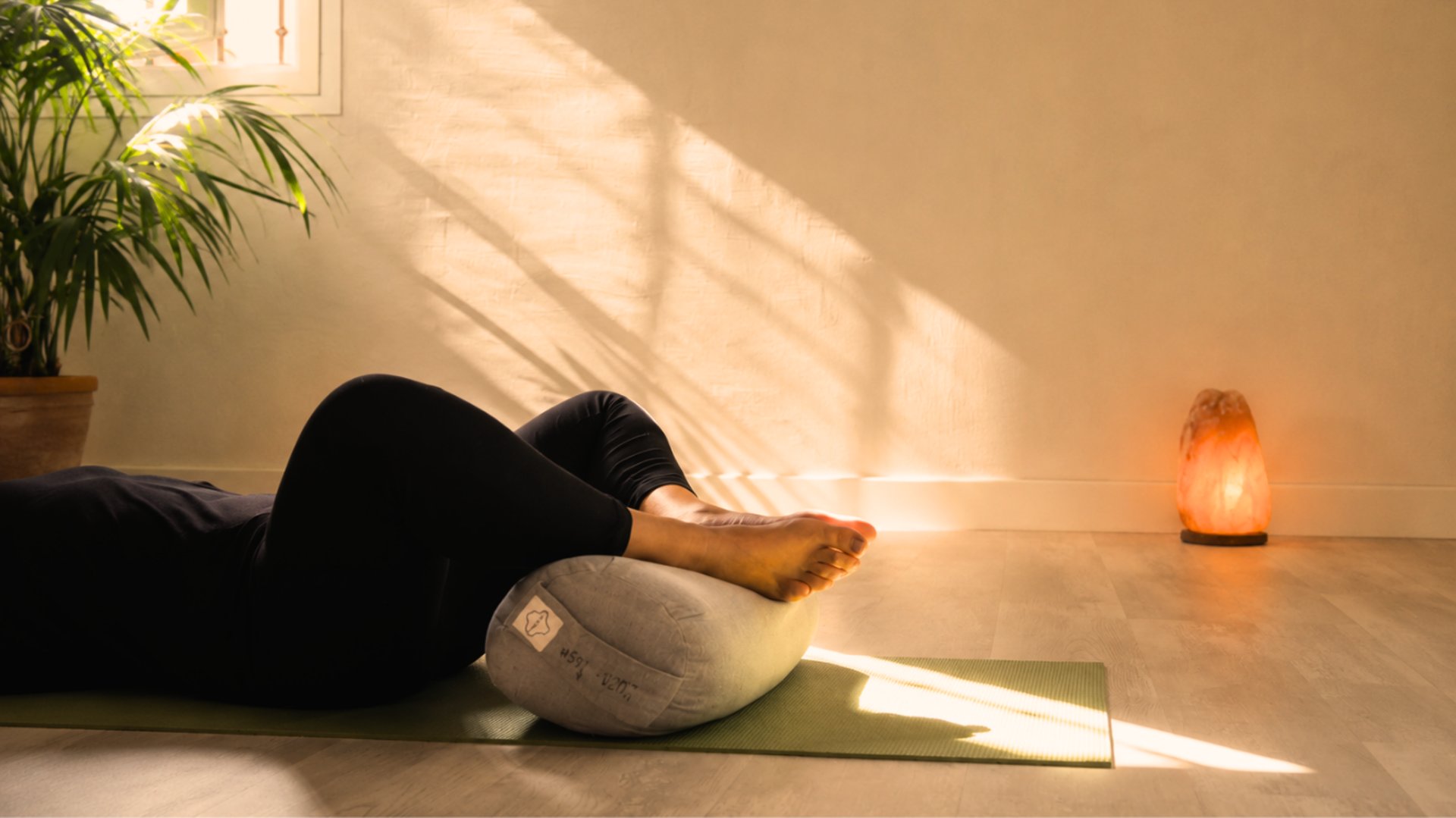 a row of yoga mats sitting on top of a wooden floor