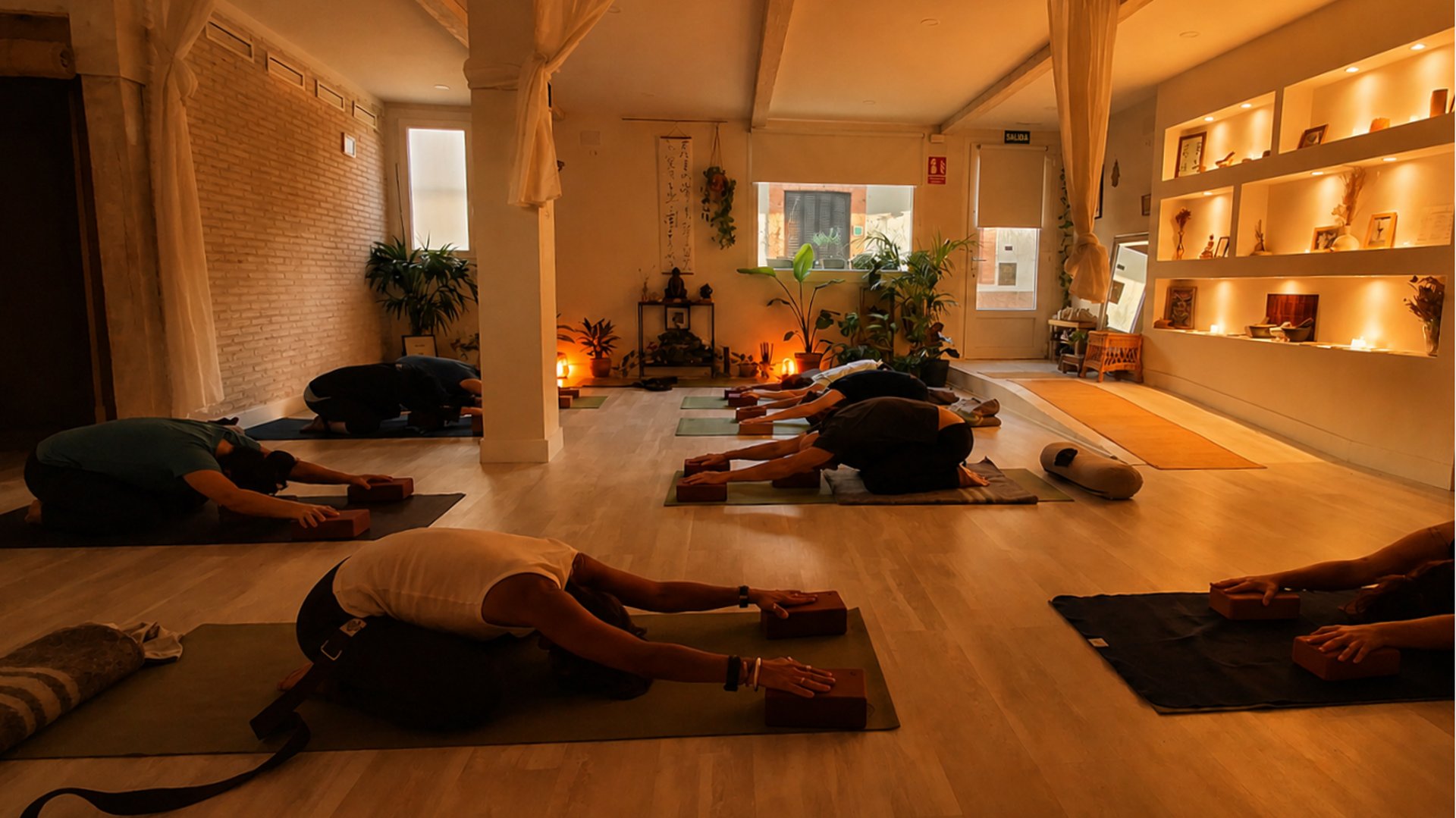 a row of yoga mats sitting on top of a wooden floor