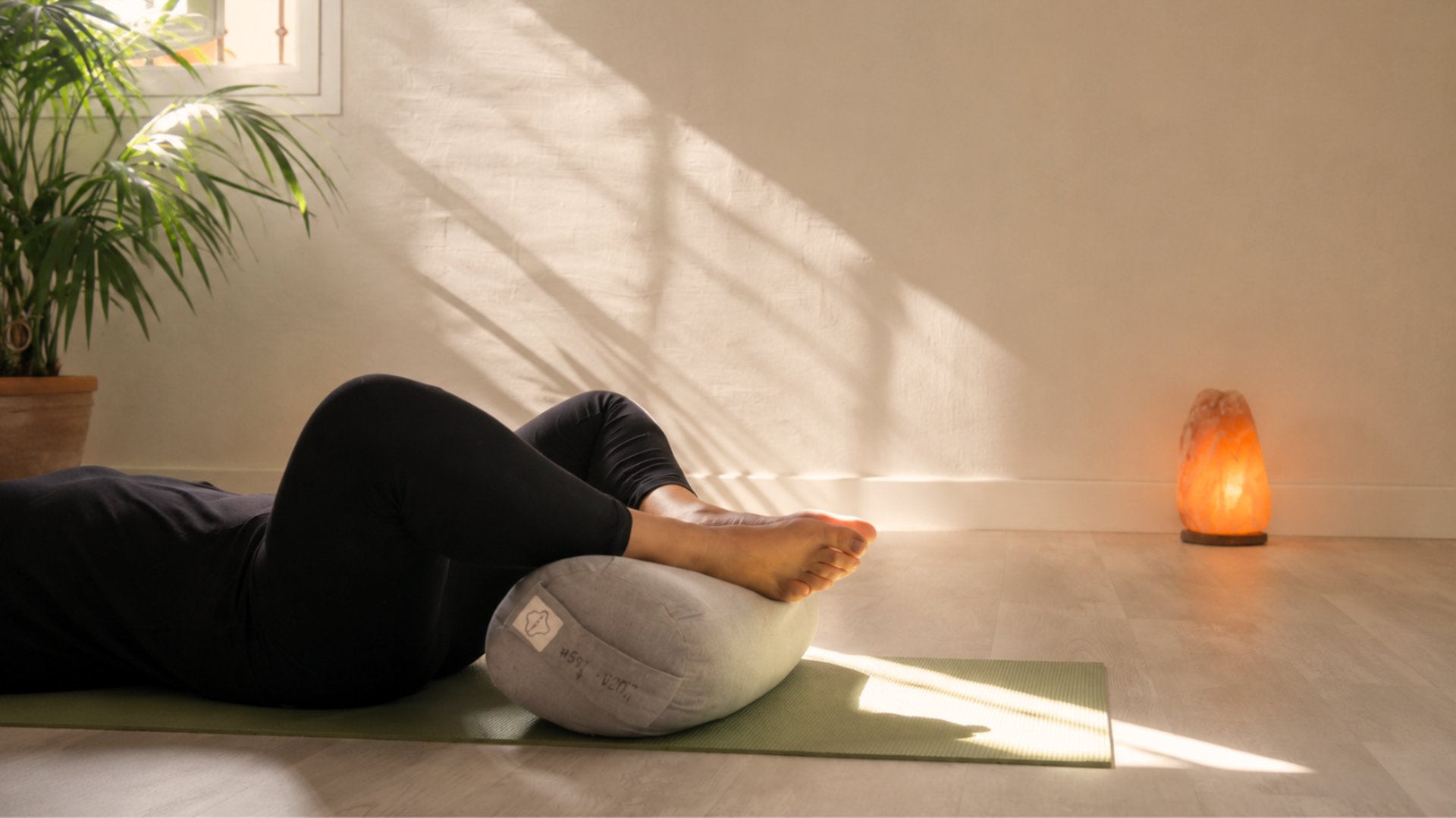 a row of yoga mats sitting on top of a wooden floor