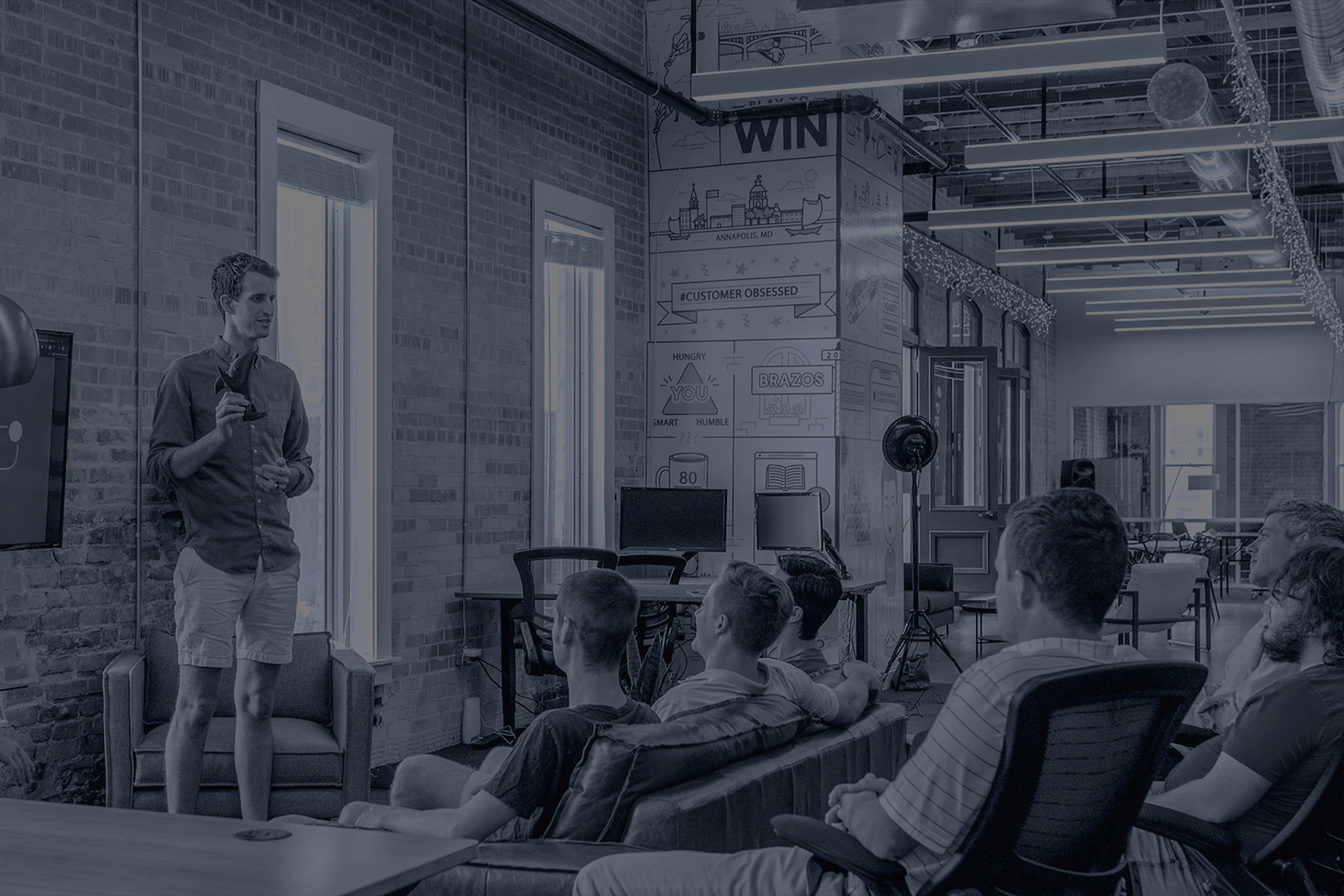 black and brown leather padded tub sofa