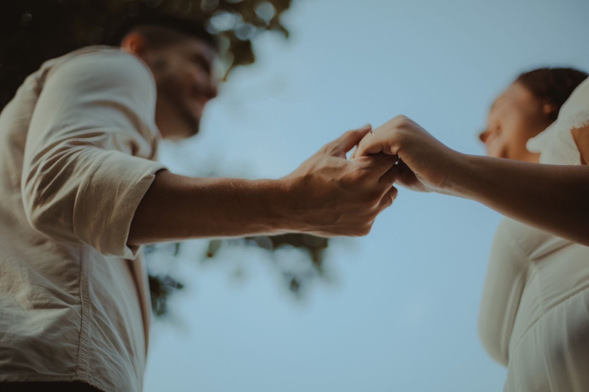 an abstract photo of a curved building with a blue sky in the background