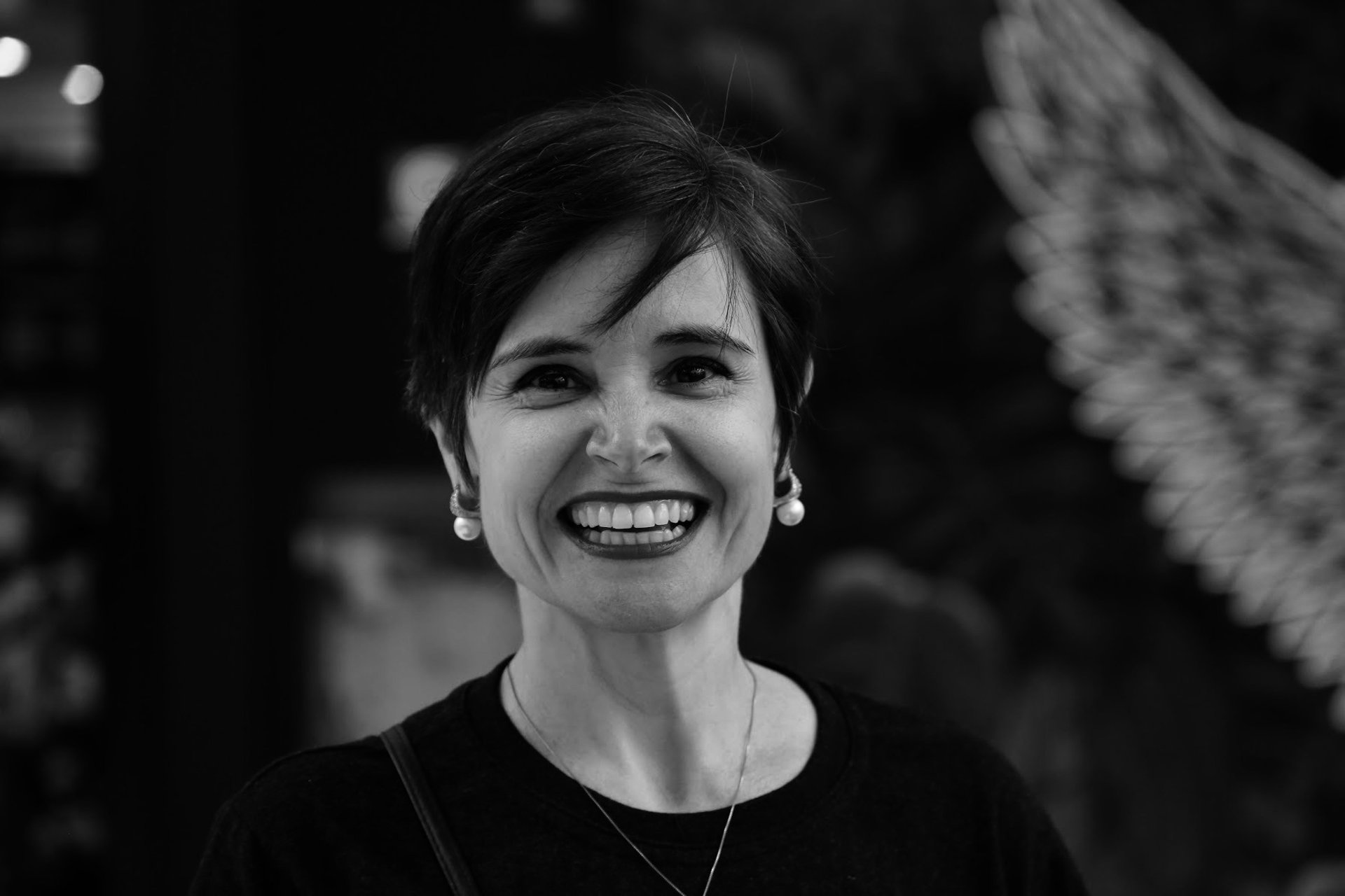 an abstract photo of a curved building with a blue sky in the background