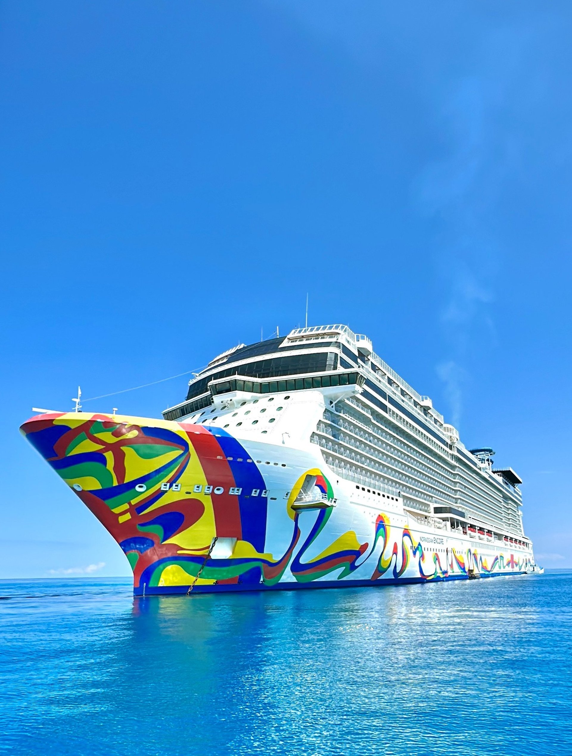 an abstract photo of a curved building with a blue sky in the background