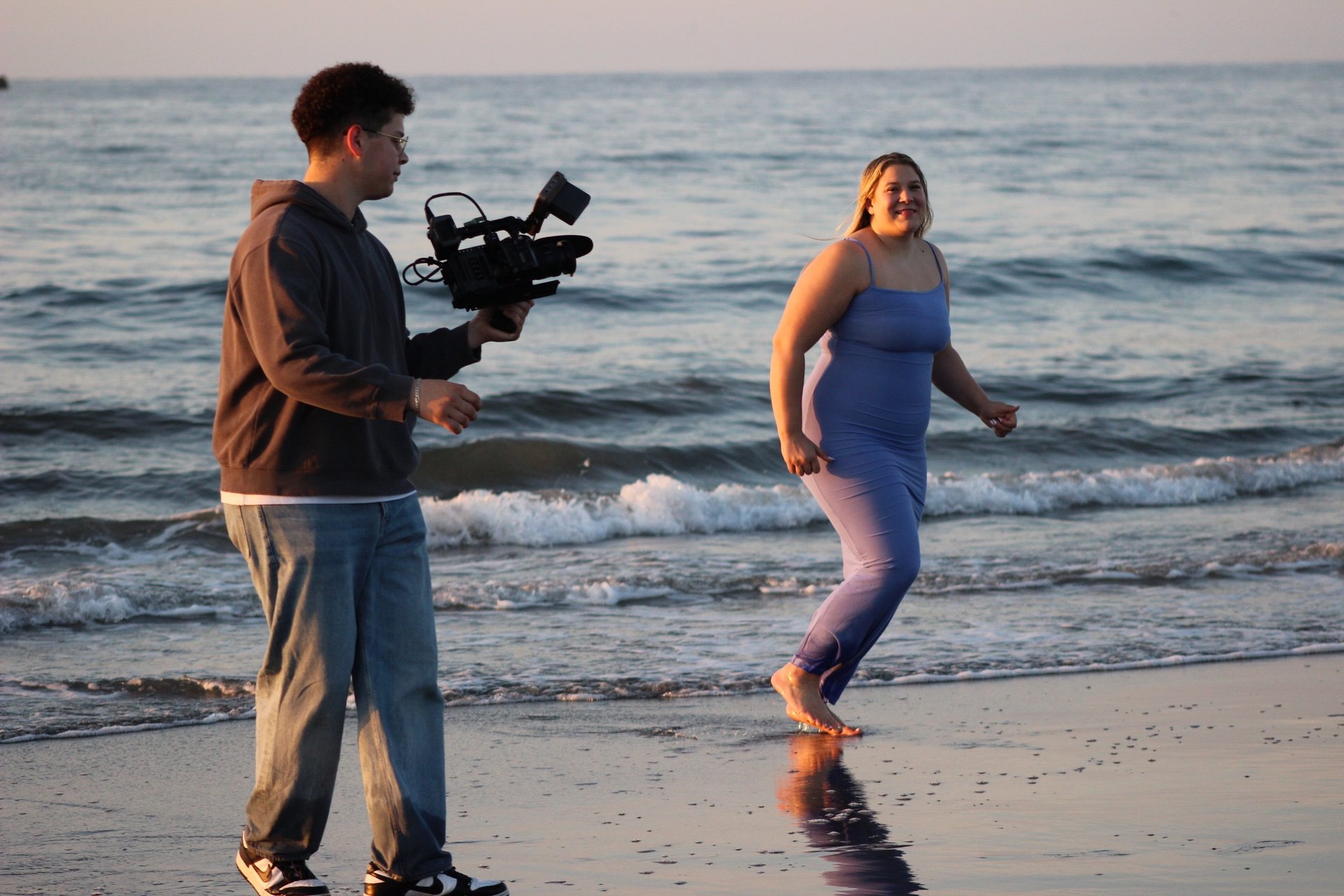 person sitting in front bookshelf