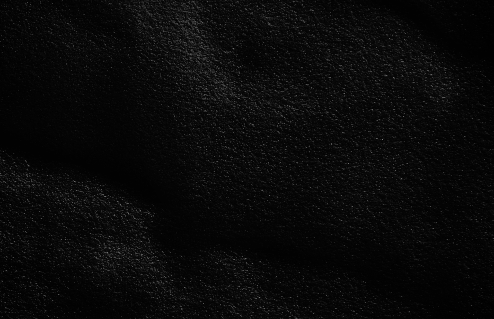 a black and white photo of water and sand