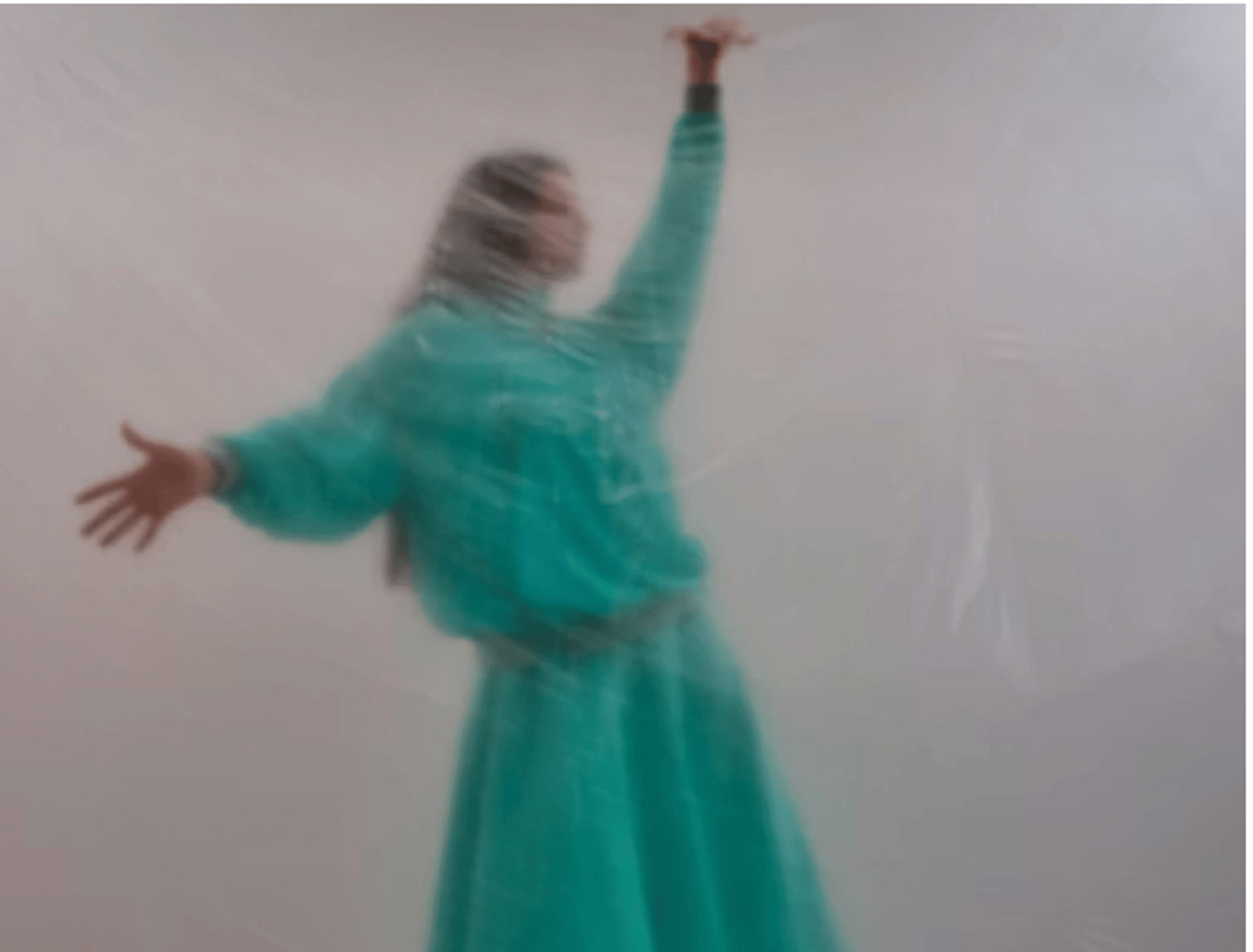 a tall building with a fire escape next to trees