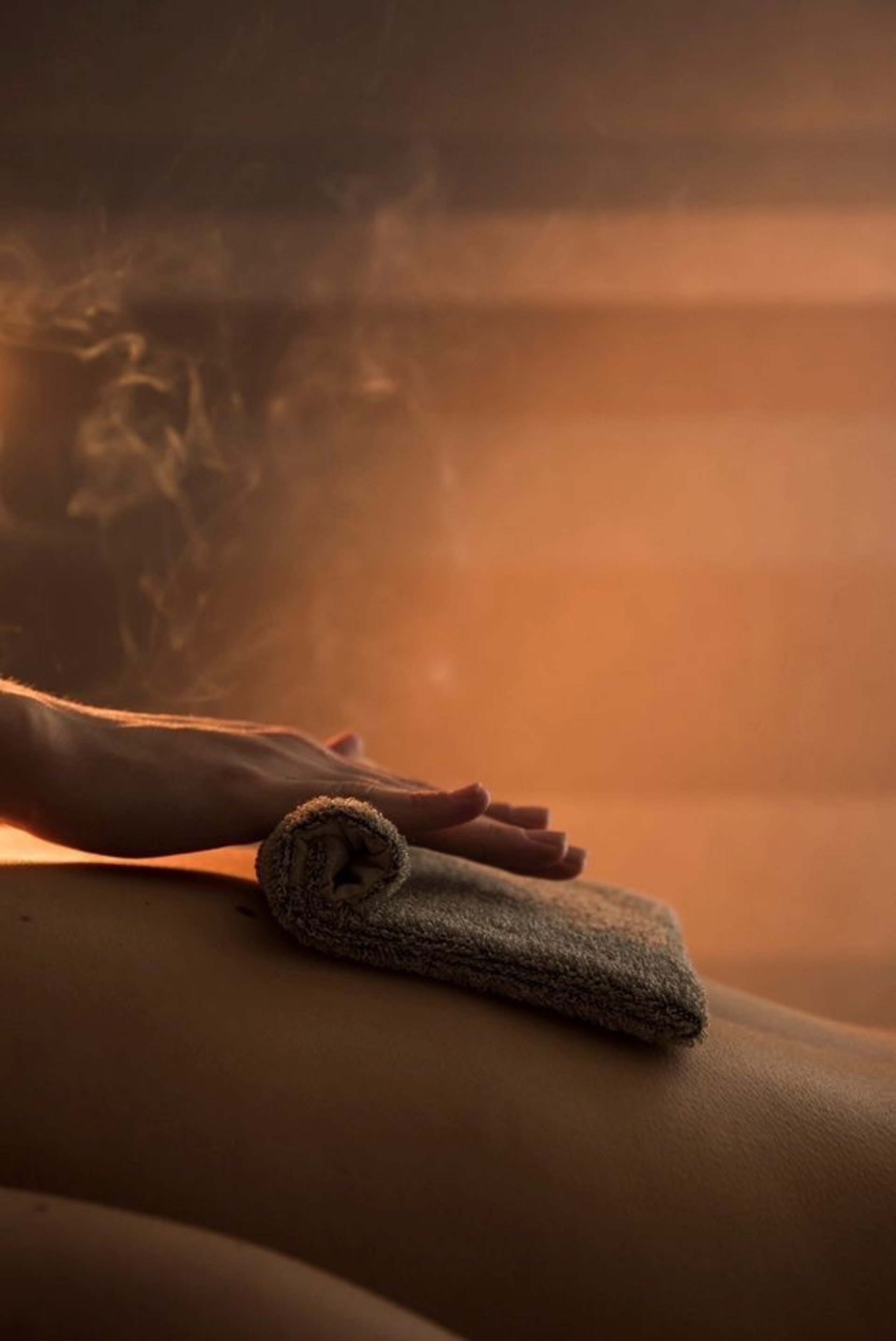 an abstract photo of a curved building with a blue sky in the background