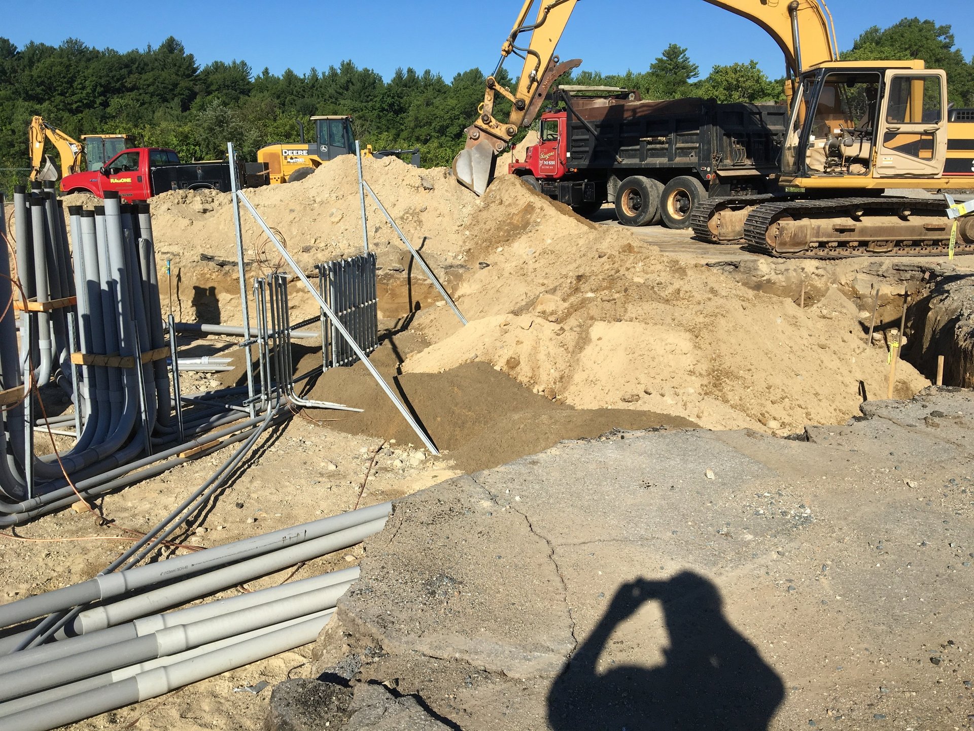 seven construction workers standing on white field