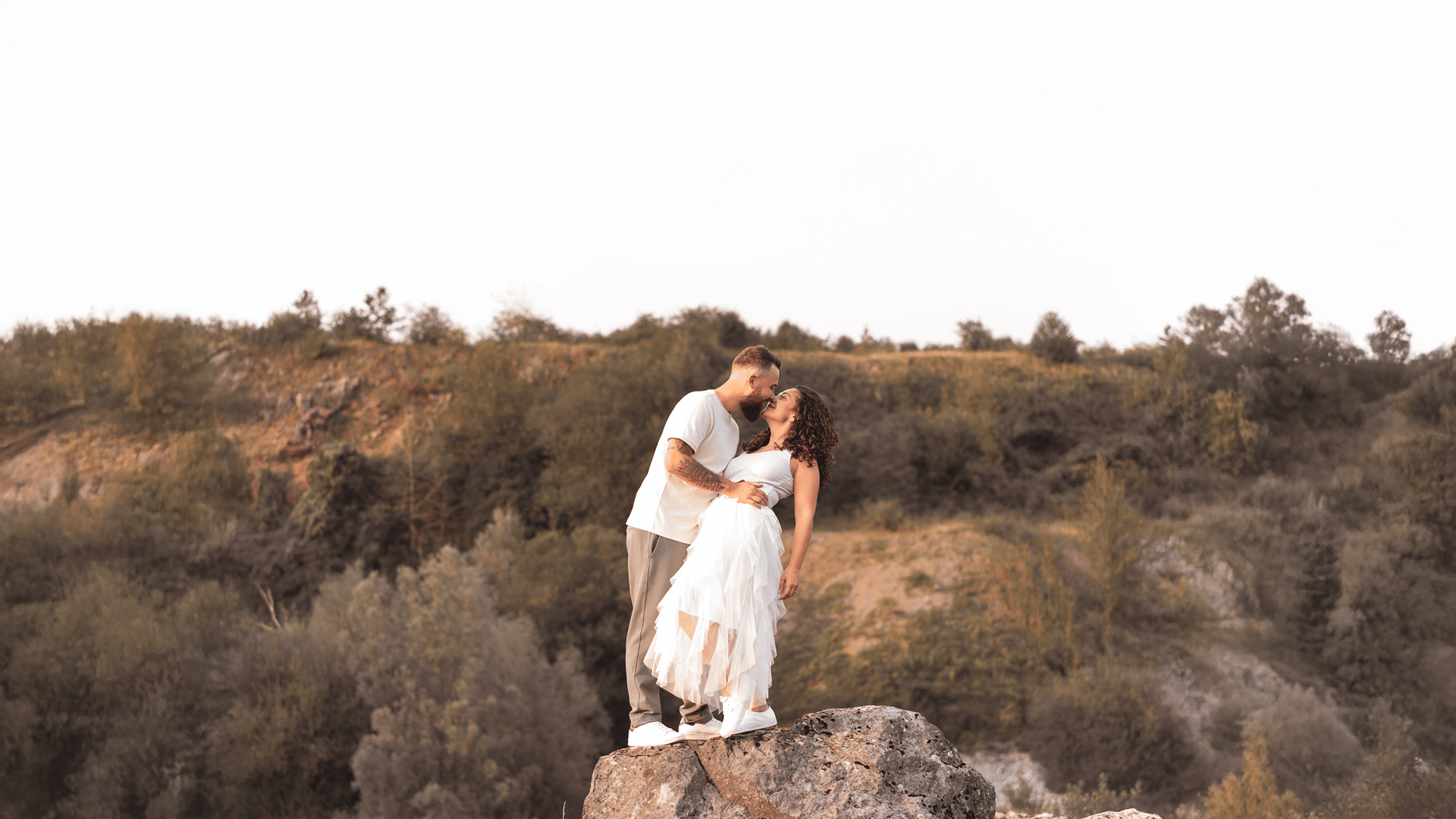 woman wearing yellow long-sleeved dress under white clouds and blue sky during daytime