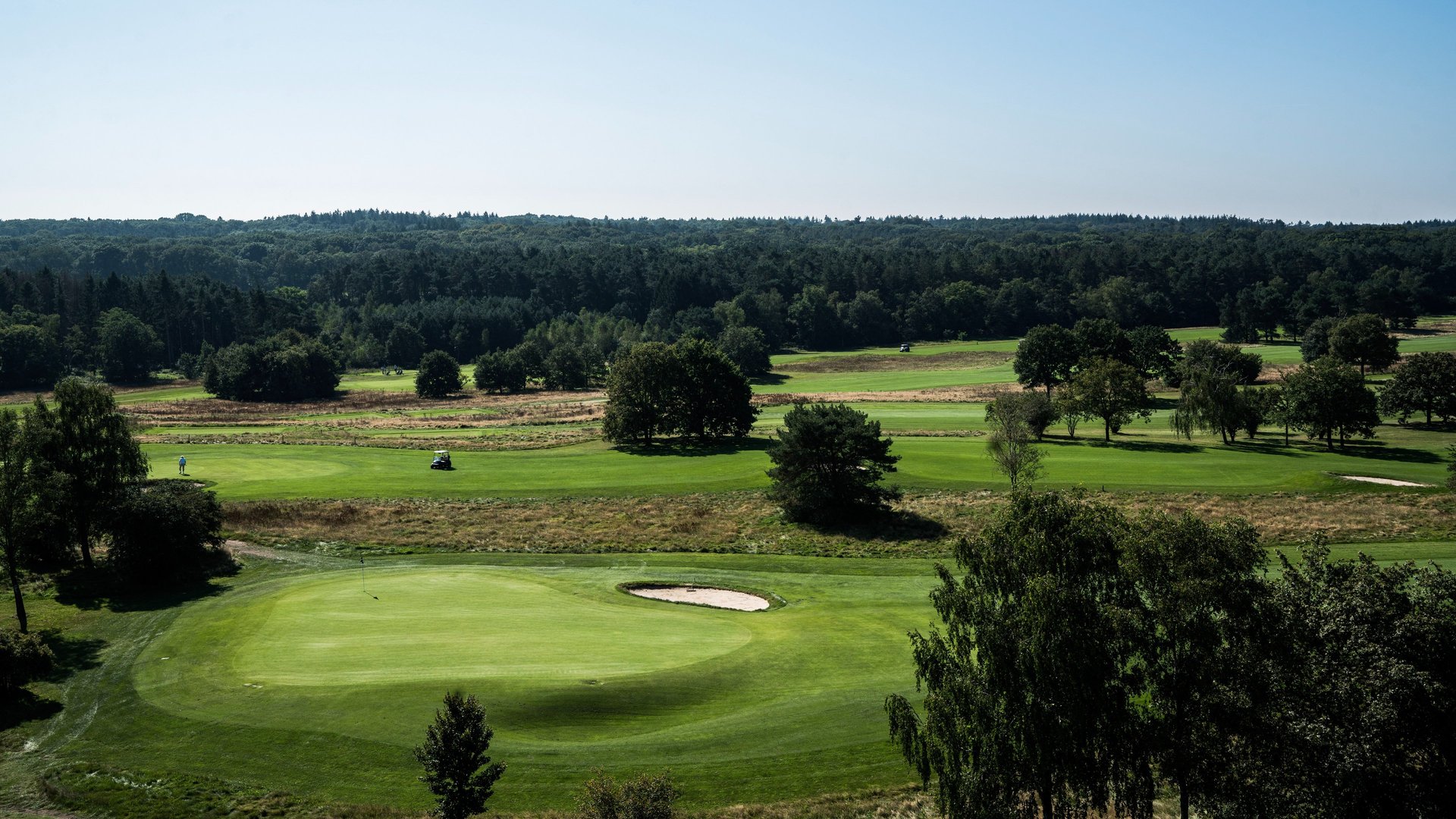 black and brown leather padded tub sofa