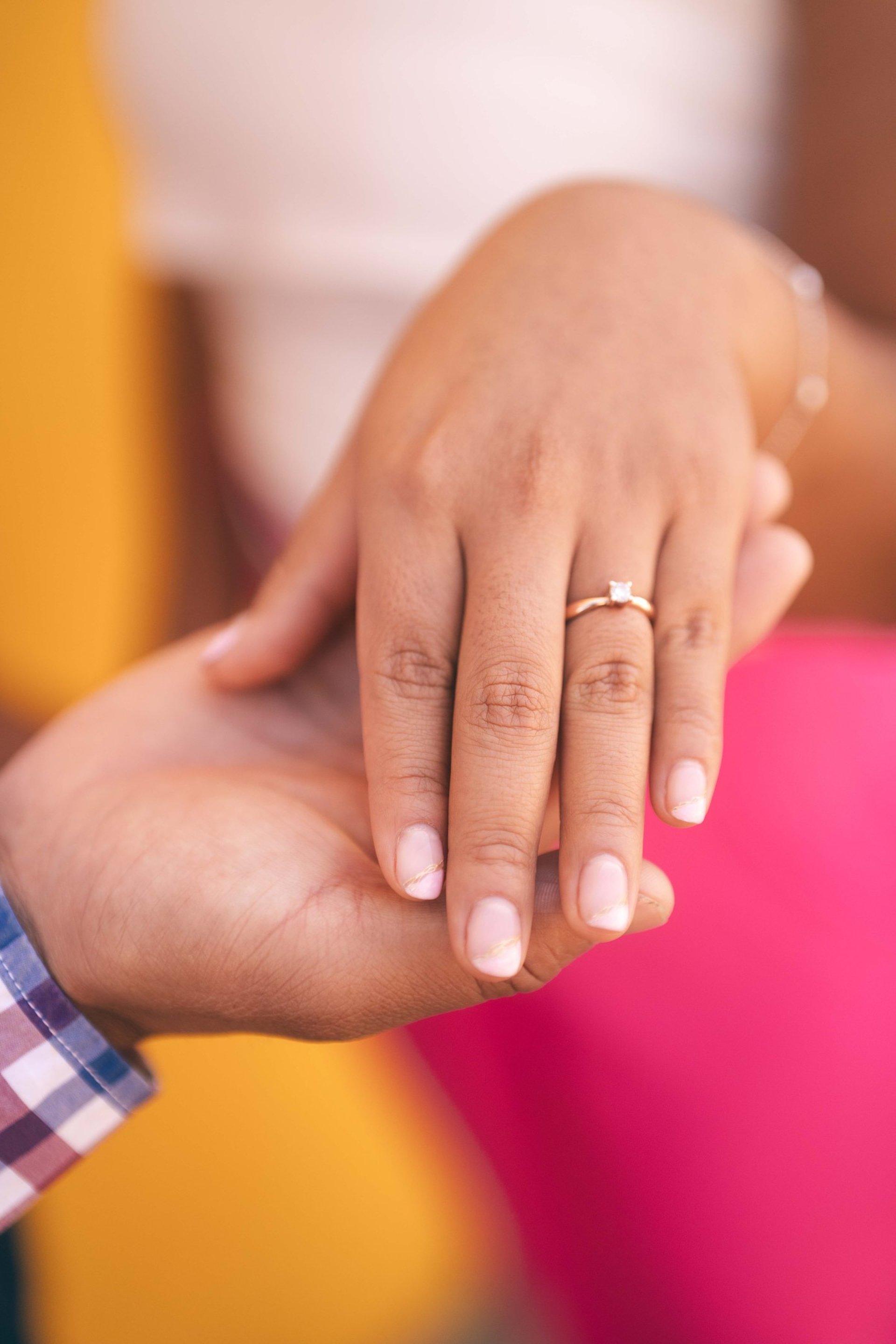 couple wearing silver-colored rings