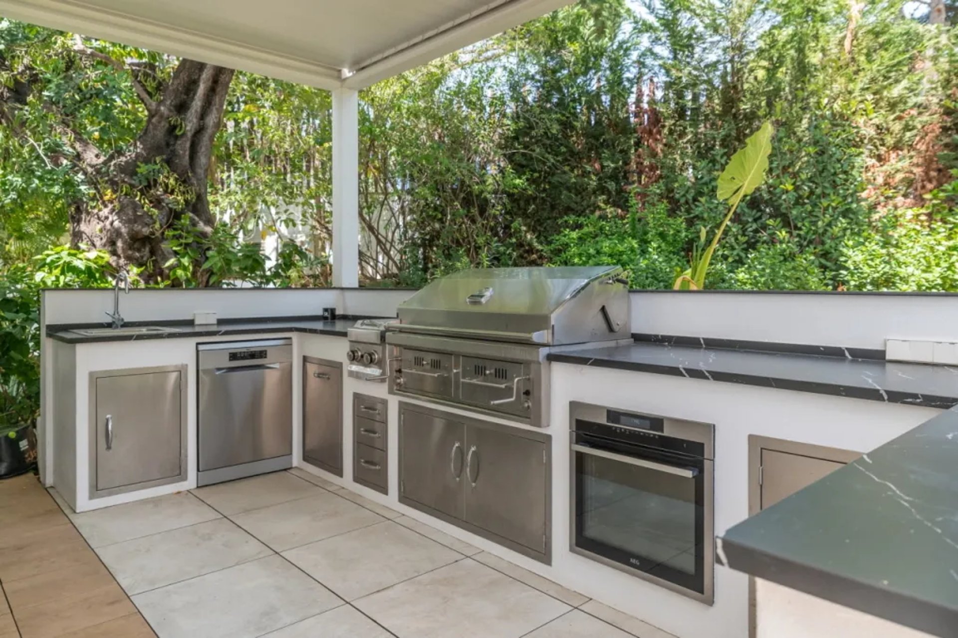 Villa Serenity outdoor kitchen with stainless appliances