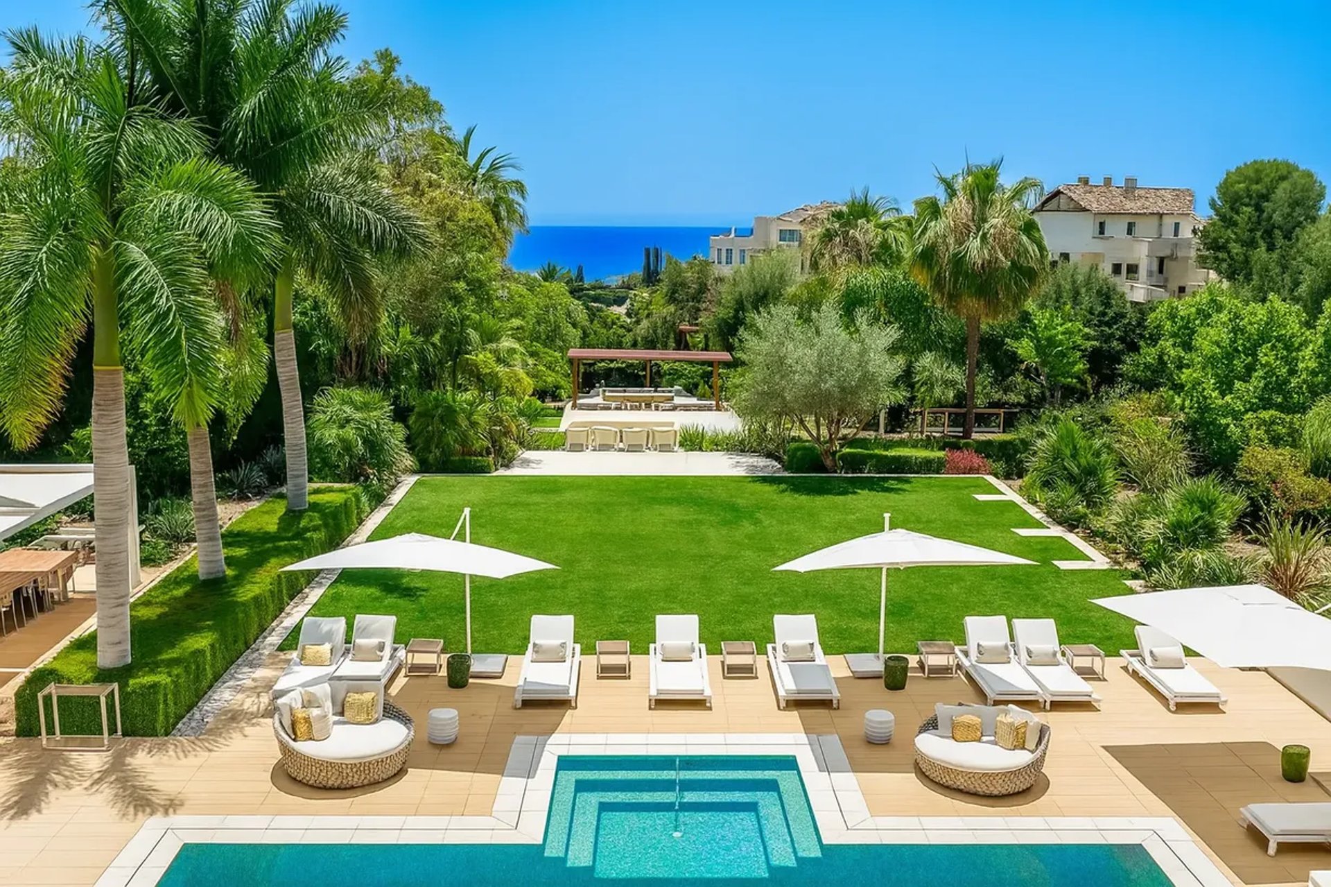 Villa Serenity garden with pool and sea views in the distance