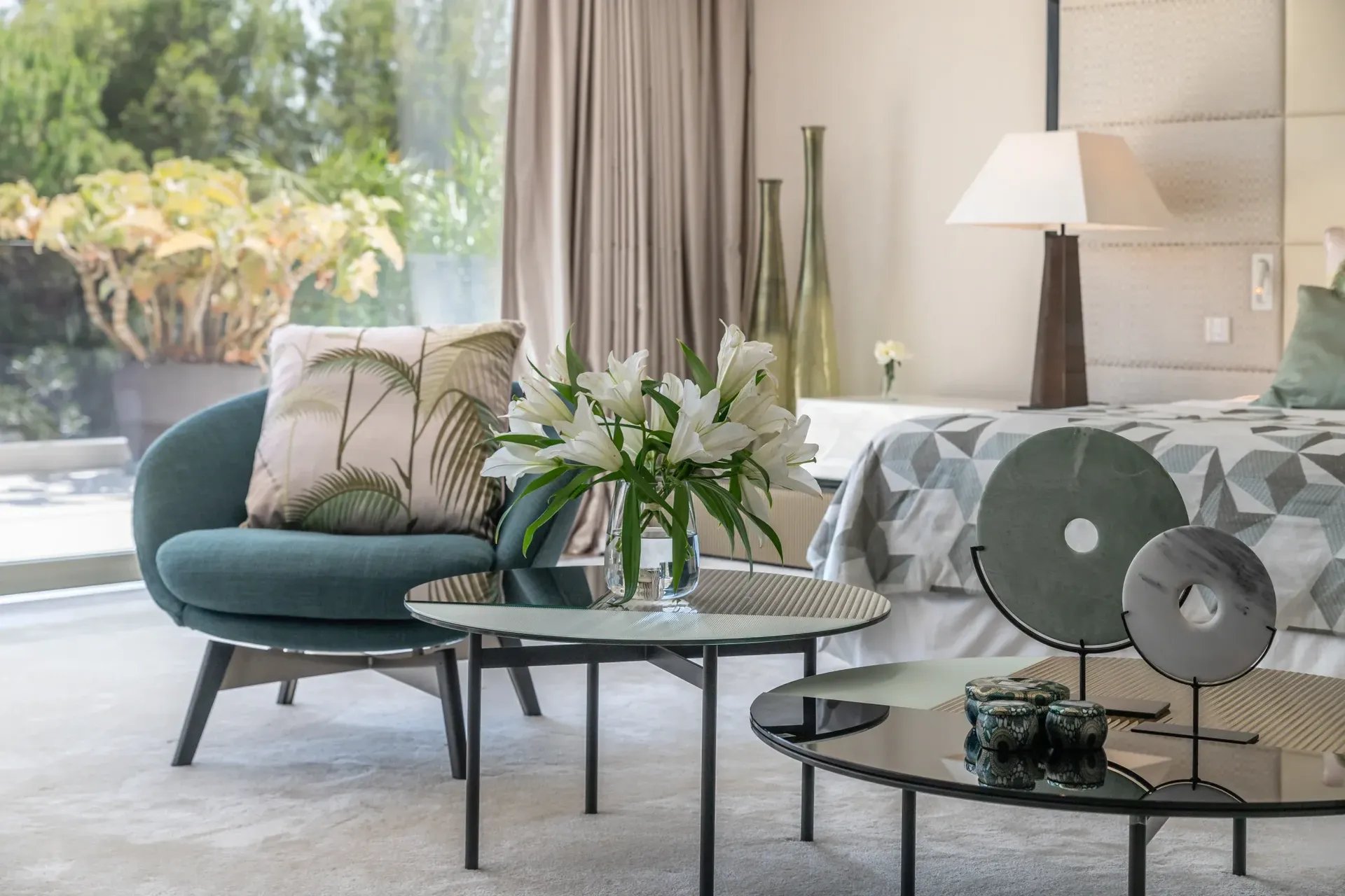 Villa Serenity suite with modern décor and floral arrangement