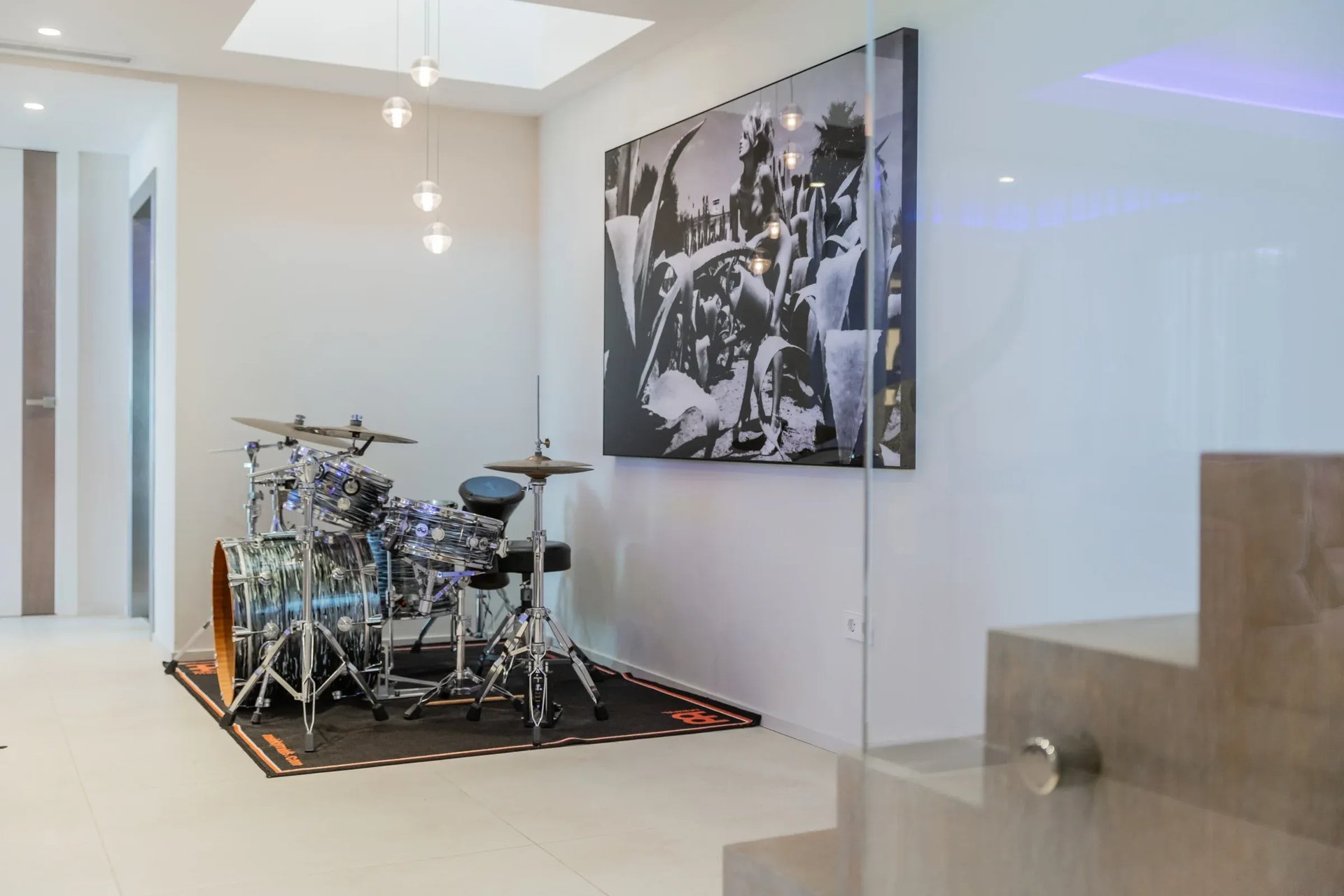 Villa Serenity music room with drum set and artwork