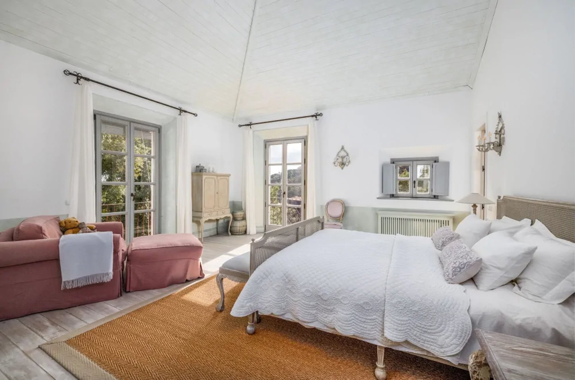 Bedroom with sofa and garden access at Finca Santa Katerina