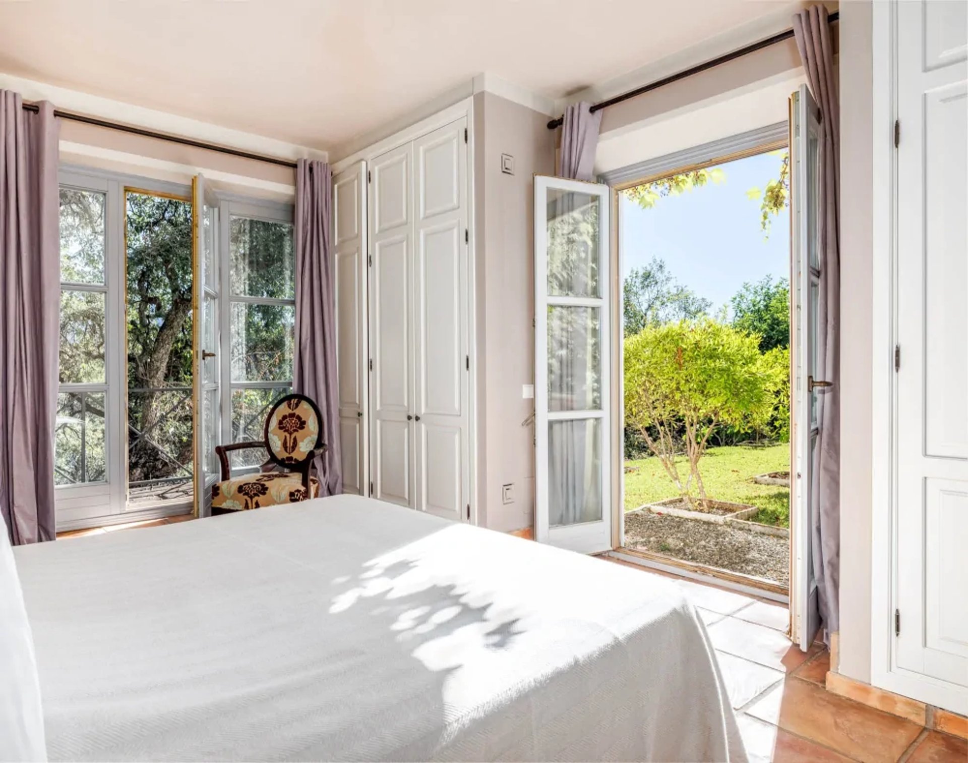 Bedroom with French doors to garden at Finca Santa Katerina