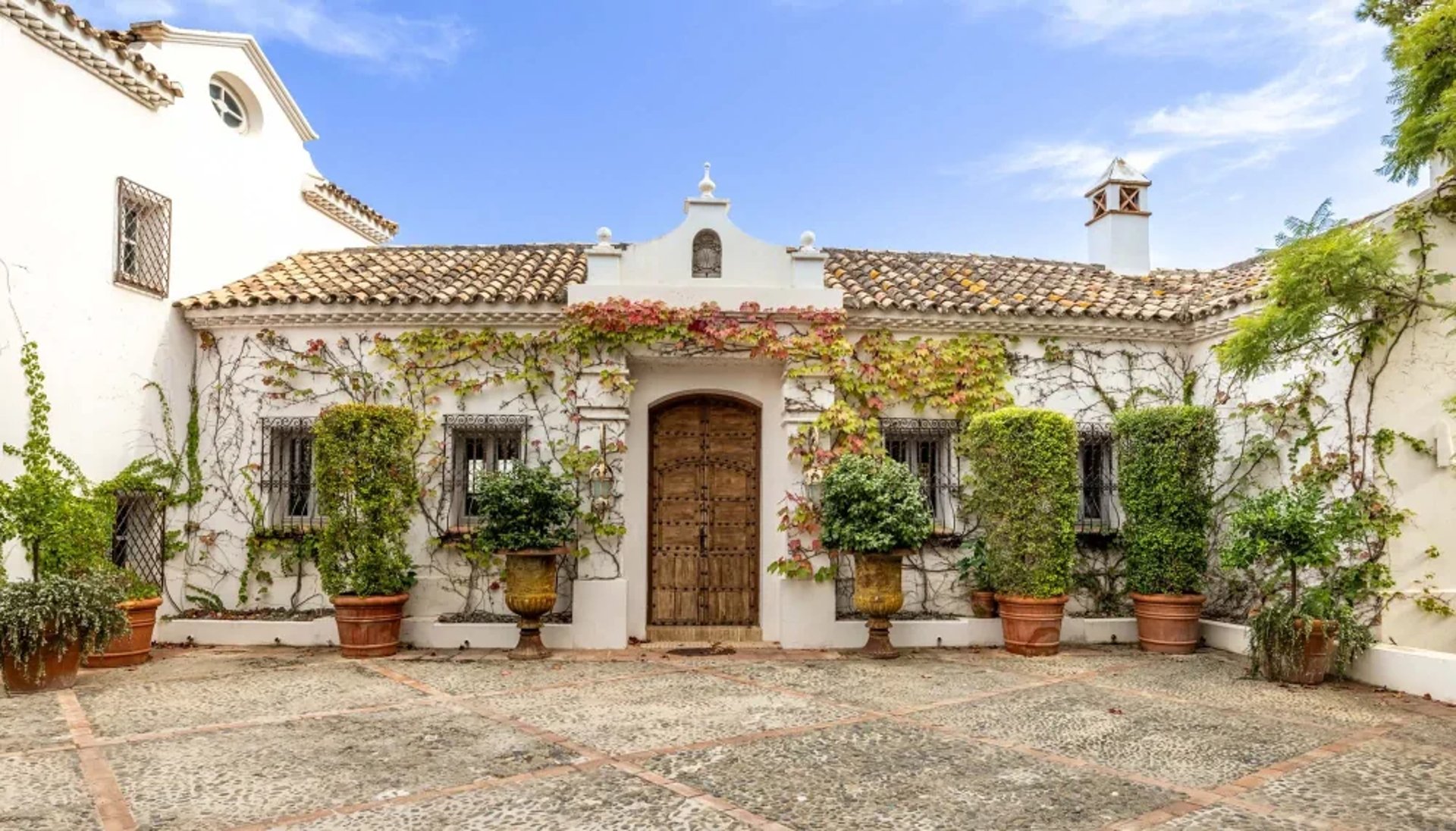 Front facade with arched entrance at Finca Santa Katerina