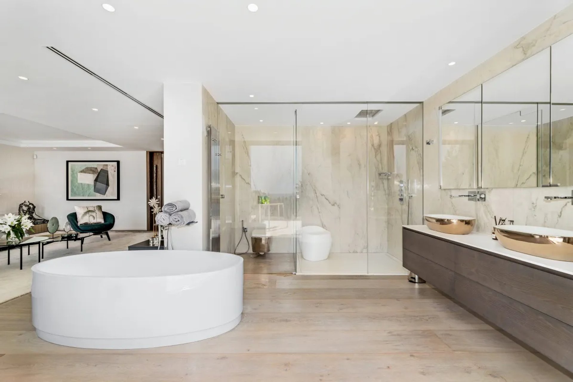 Spacious bathroom at Villa Serenity with circular white bathtub
